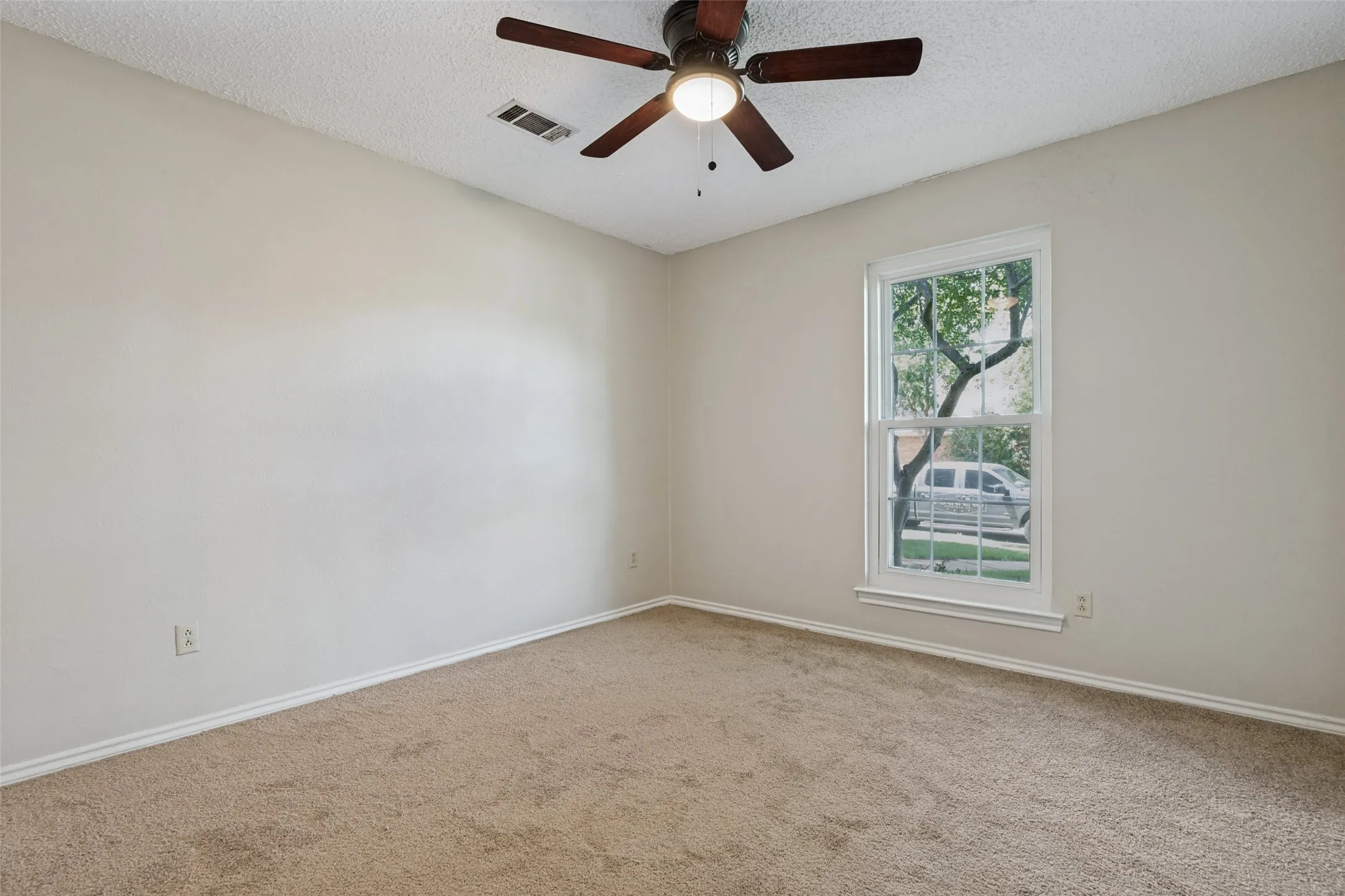New carpet and ceiling fan.
