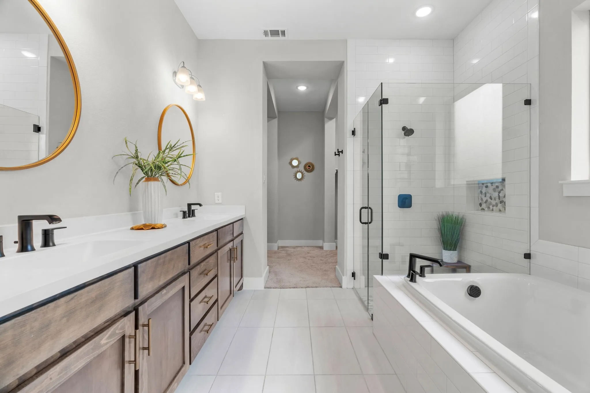 Dual vanity with white countertops and undermount sinks