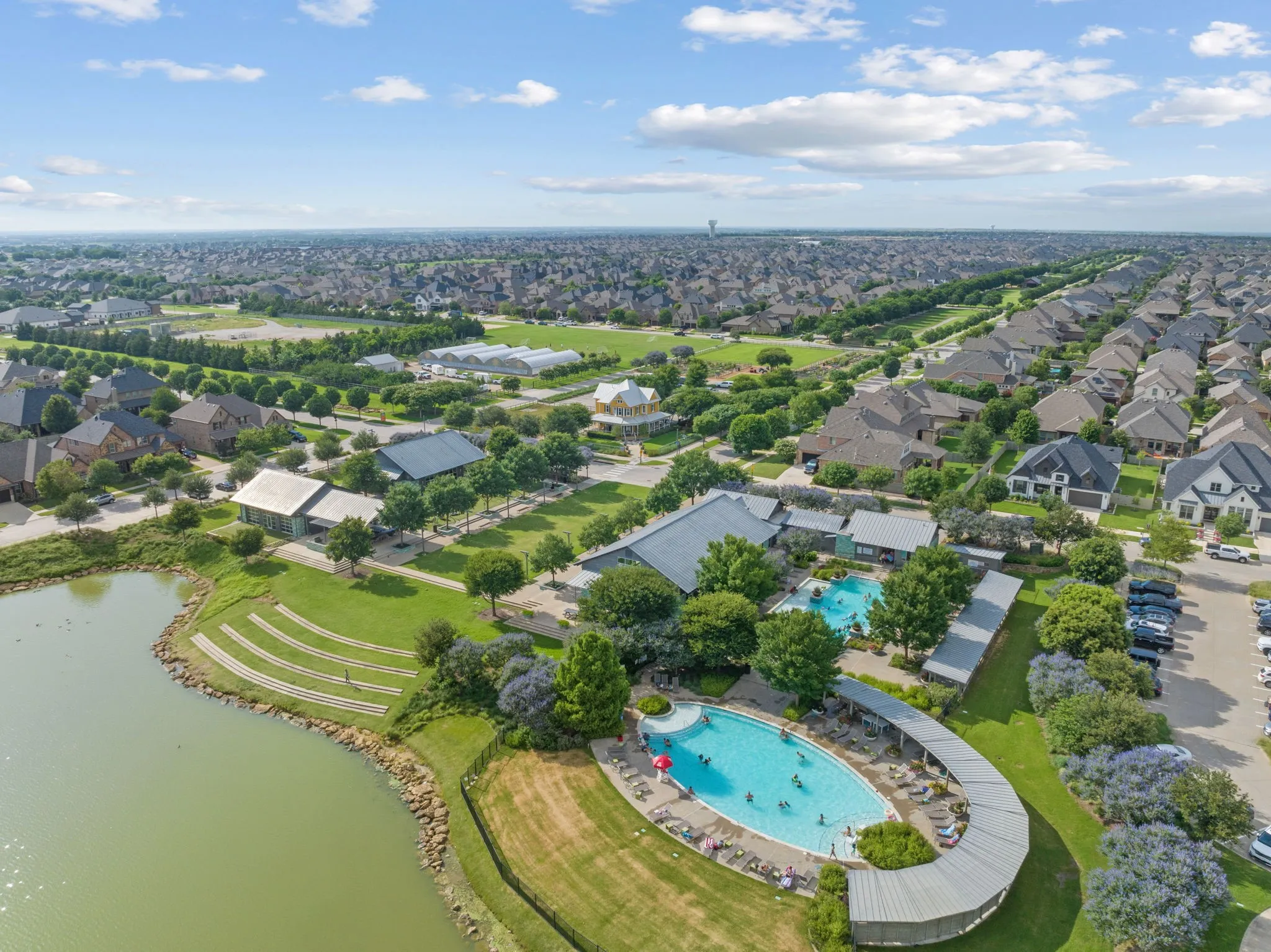 Aerial perspective showcasing a residential community with abundant green spaces