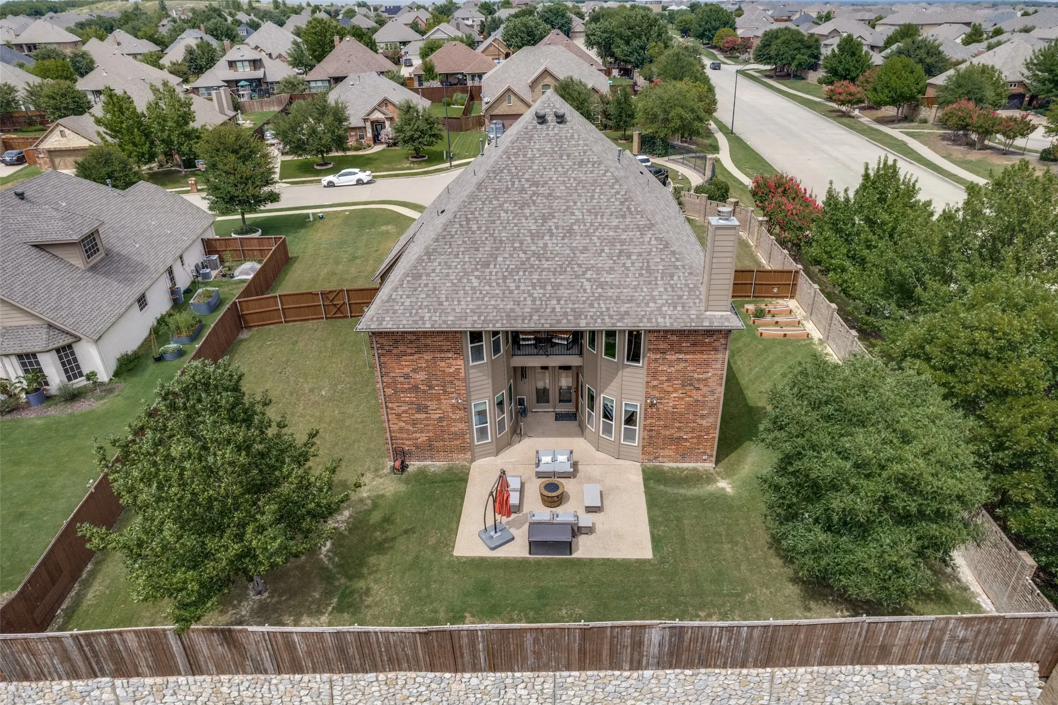 Expansive 80' lot showcasing a beautiful lot expansive patio for entertaining, cooking, relaxing.