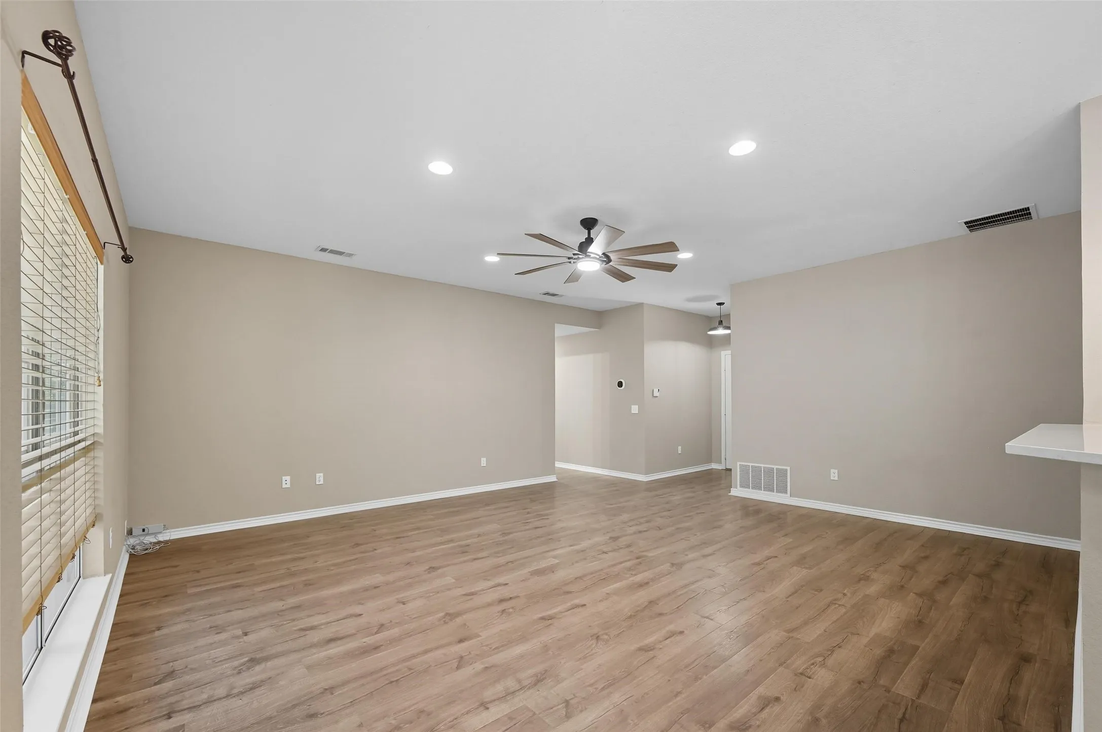 Spare room featuring light wood-style floors, recessed lighting, and a ceiling fan