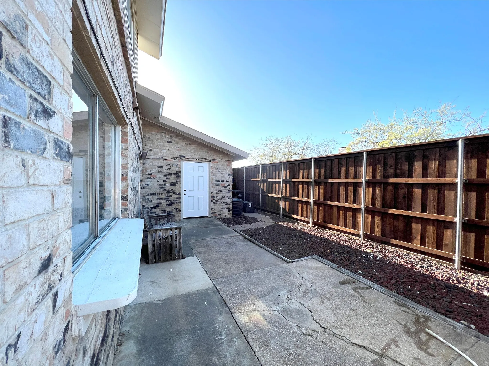 Large patio and rock garden beds - great space for a container garden