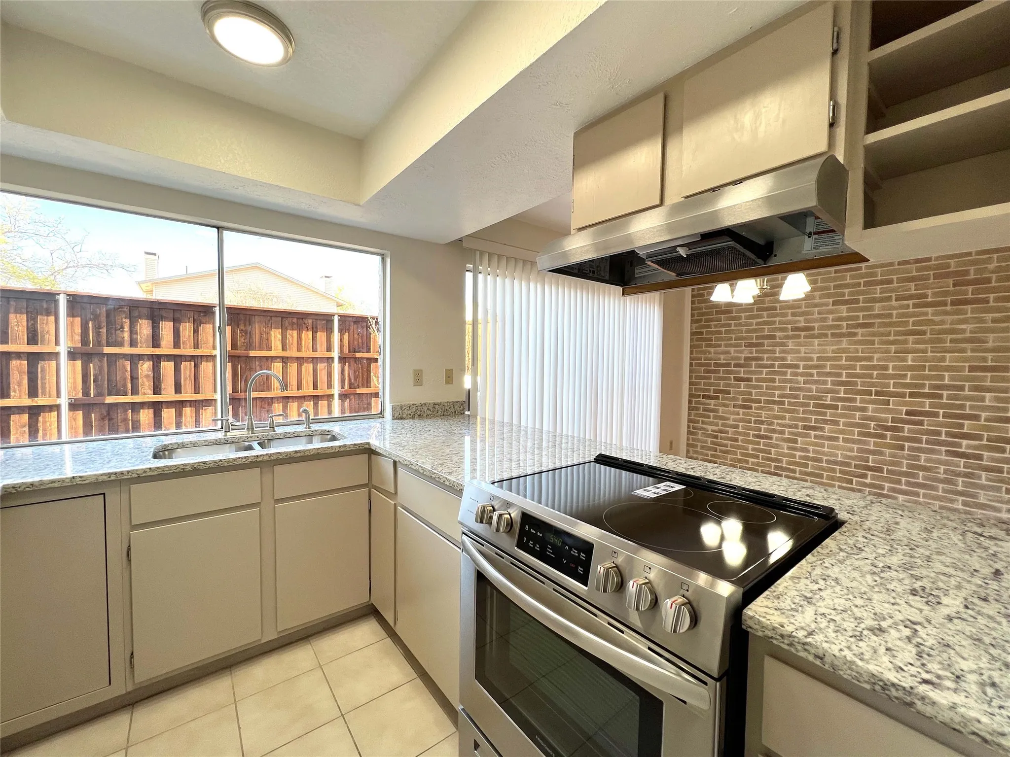 Updated Stainless, sink, range, and dishwasher and lighting