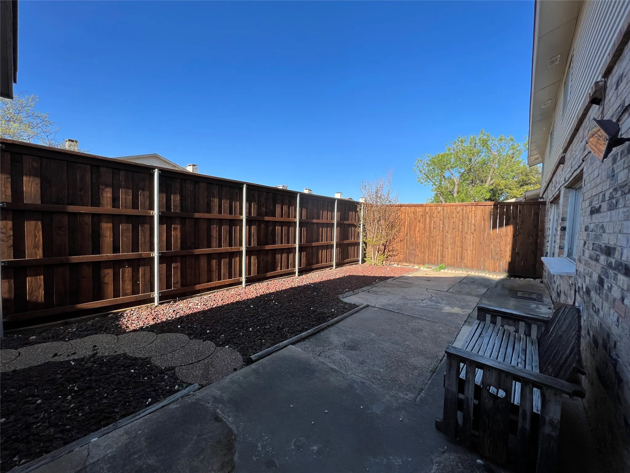 Add some greenery and patio furniture and this space makes a lovely view for main floor rooms