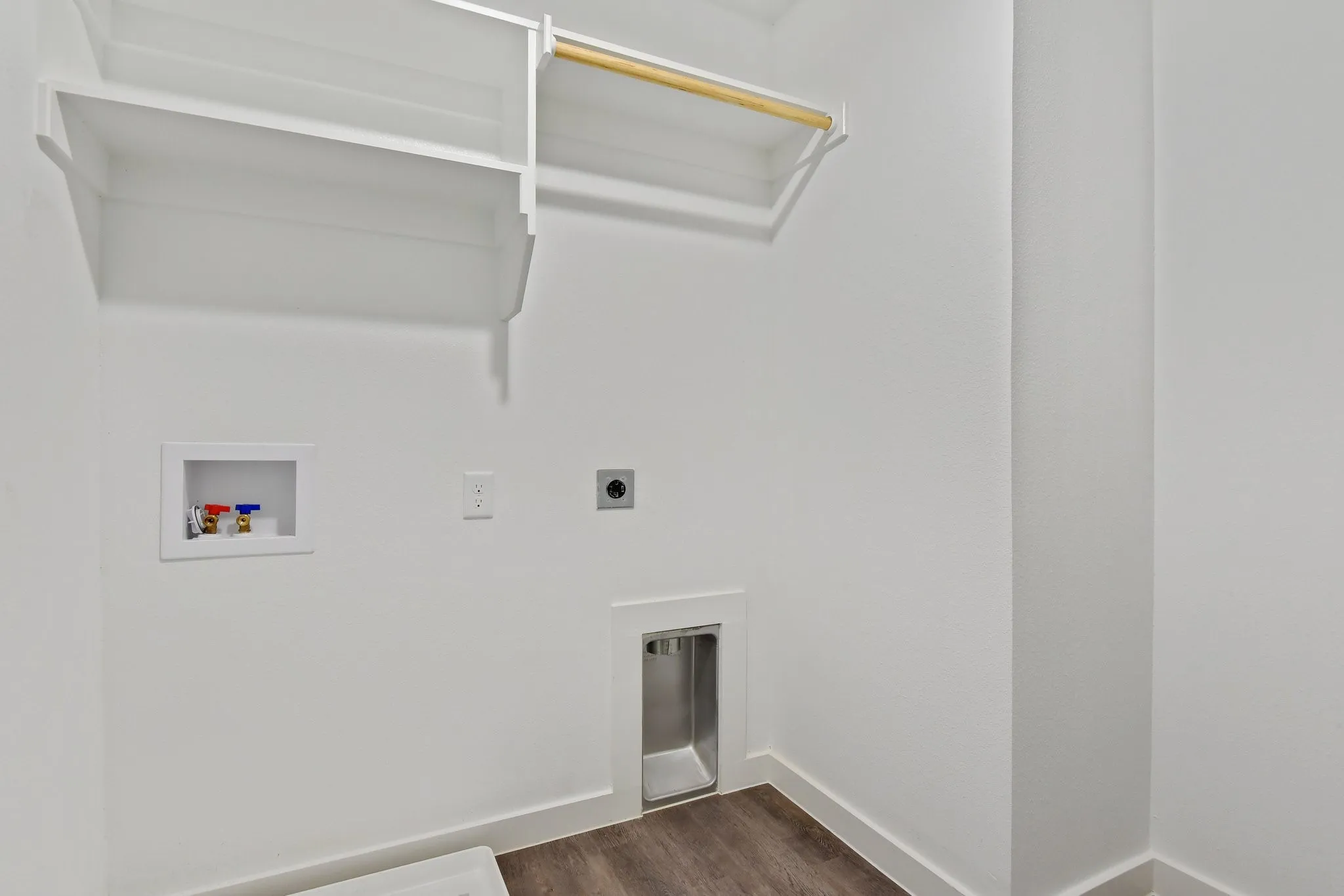 Laundry area featuring hookup for a washing machine, dark wood-style flooring, and hookup for an electric dryer