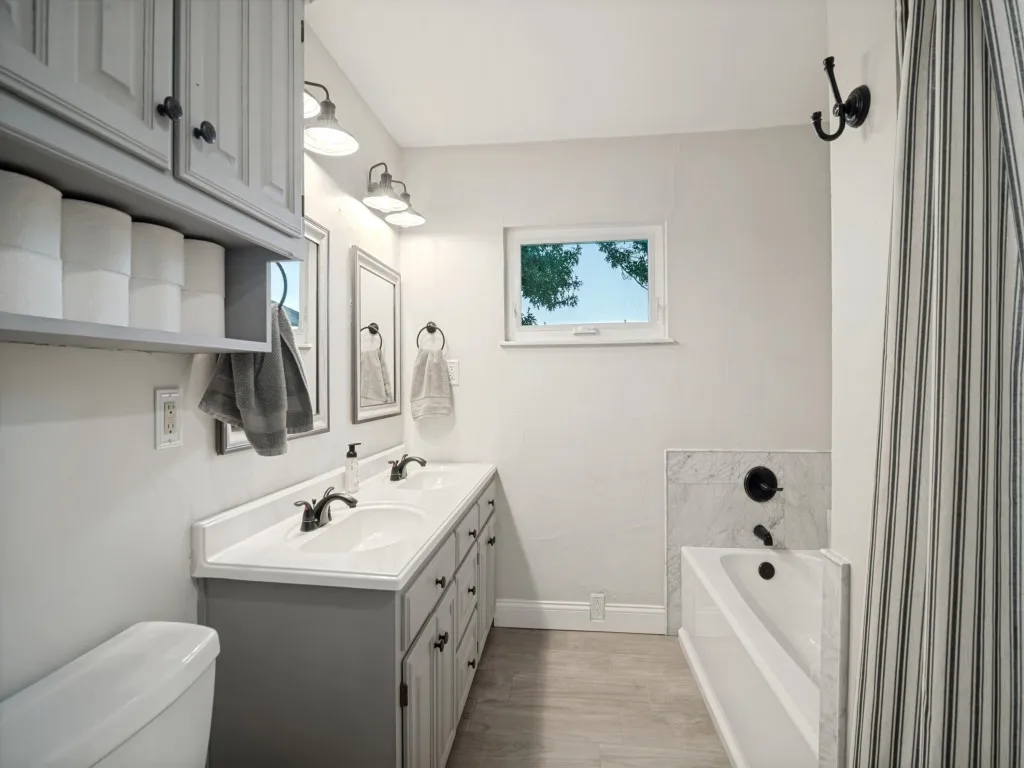 Double sink vanity and separate bath and shower makes sharing your space comfortably easy.