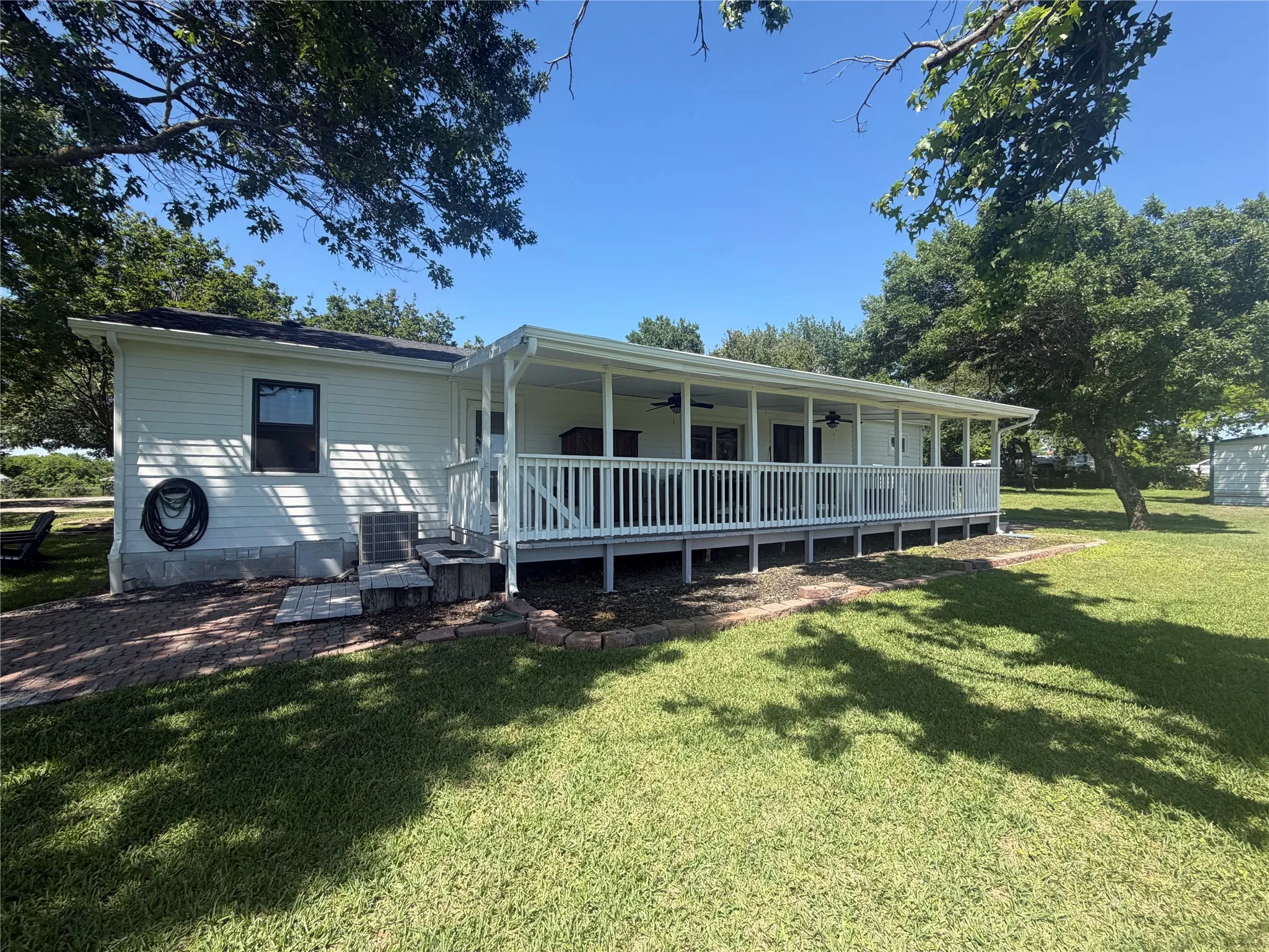 Approx. 432 sf of outdoor covered living space (36 x 12) to enjoy! And the view out to the fenced acreage is beautiful and peaceful.