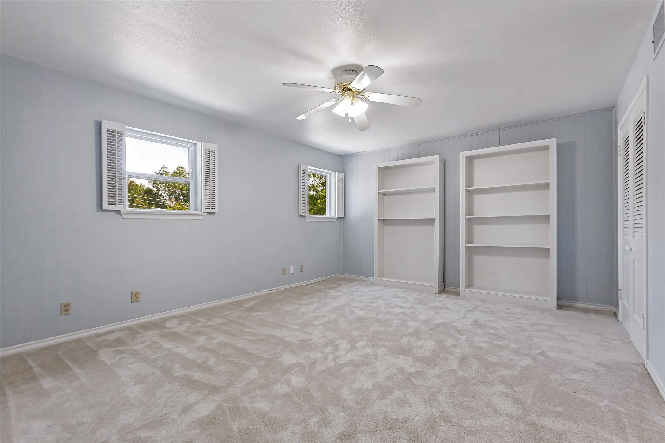 Second floor bonus has two built-in shelving units and two closets. Could be a 5th bedroom...