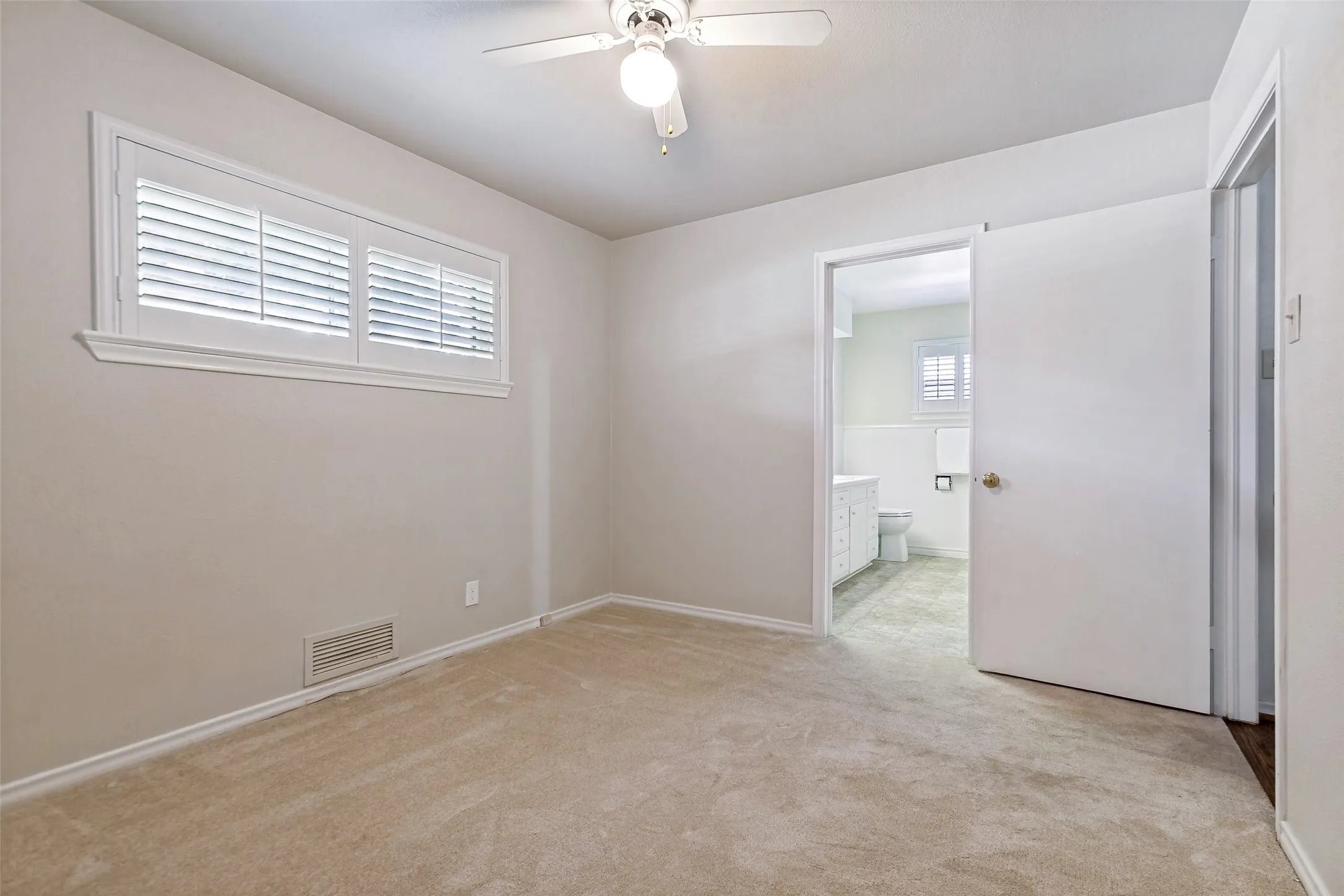 Secondary first floor bedroom with shared bath.
