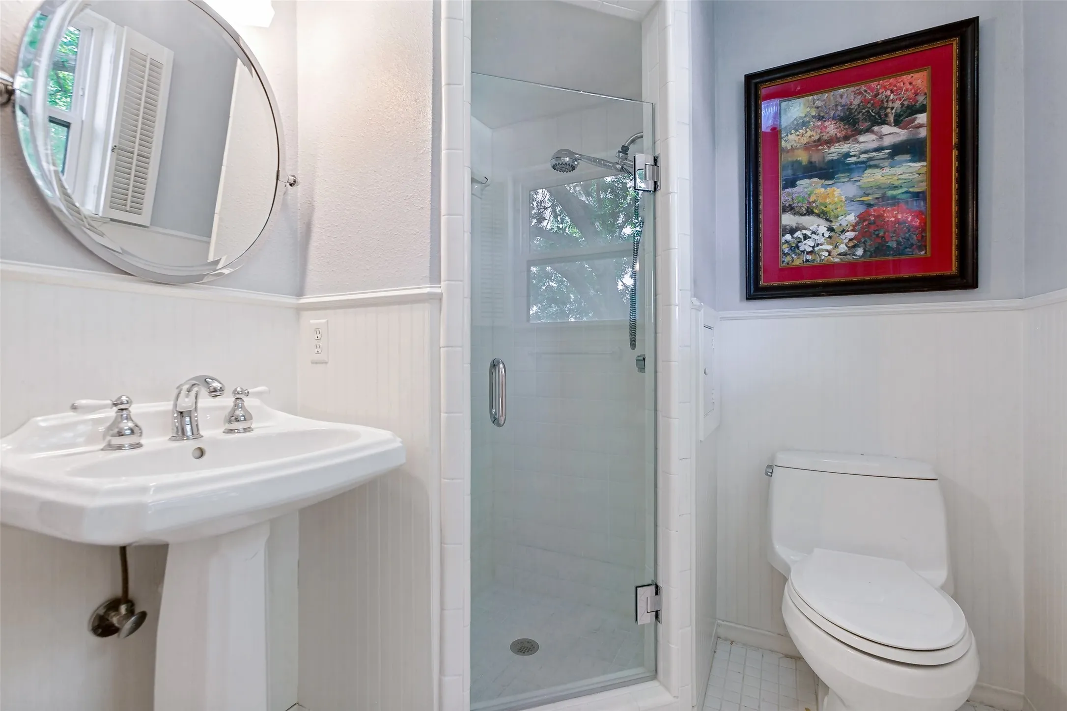 4th bedroom private bath with shower and pedestal sink. Storage cabinet not pictured.