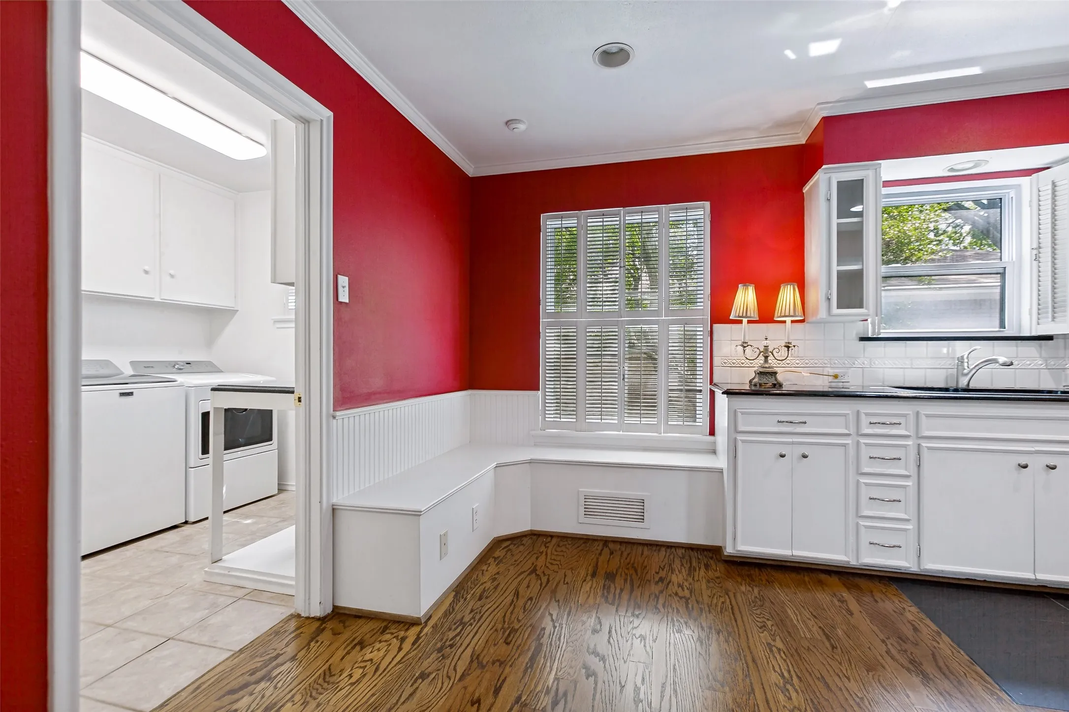 Breakfast banquette! And glimpse of the utility room.