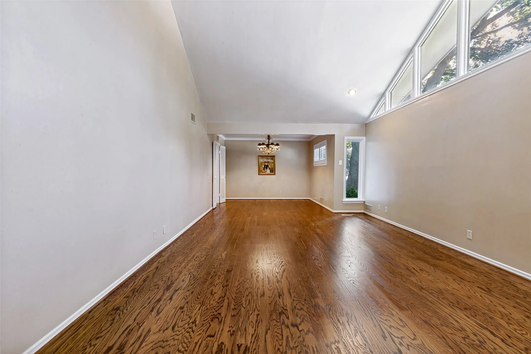 Looking from entry through the living room to the formal dining.