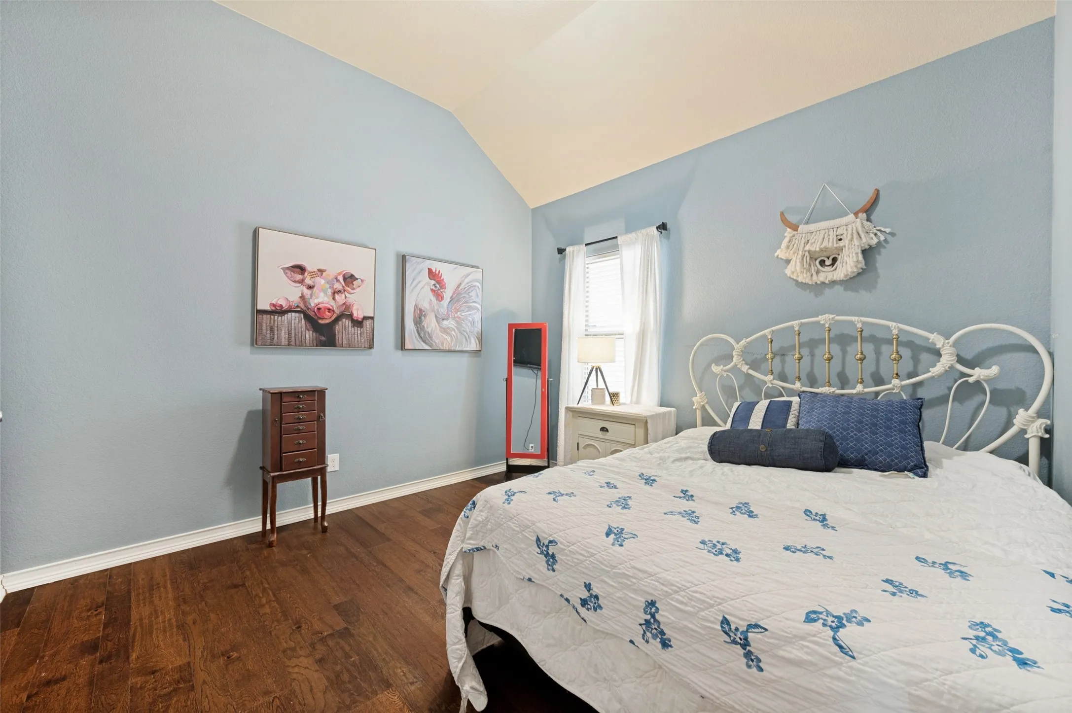 Vaulted ceiling with wood-finish flooring