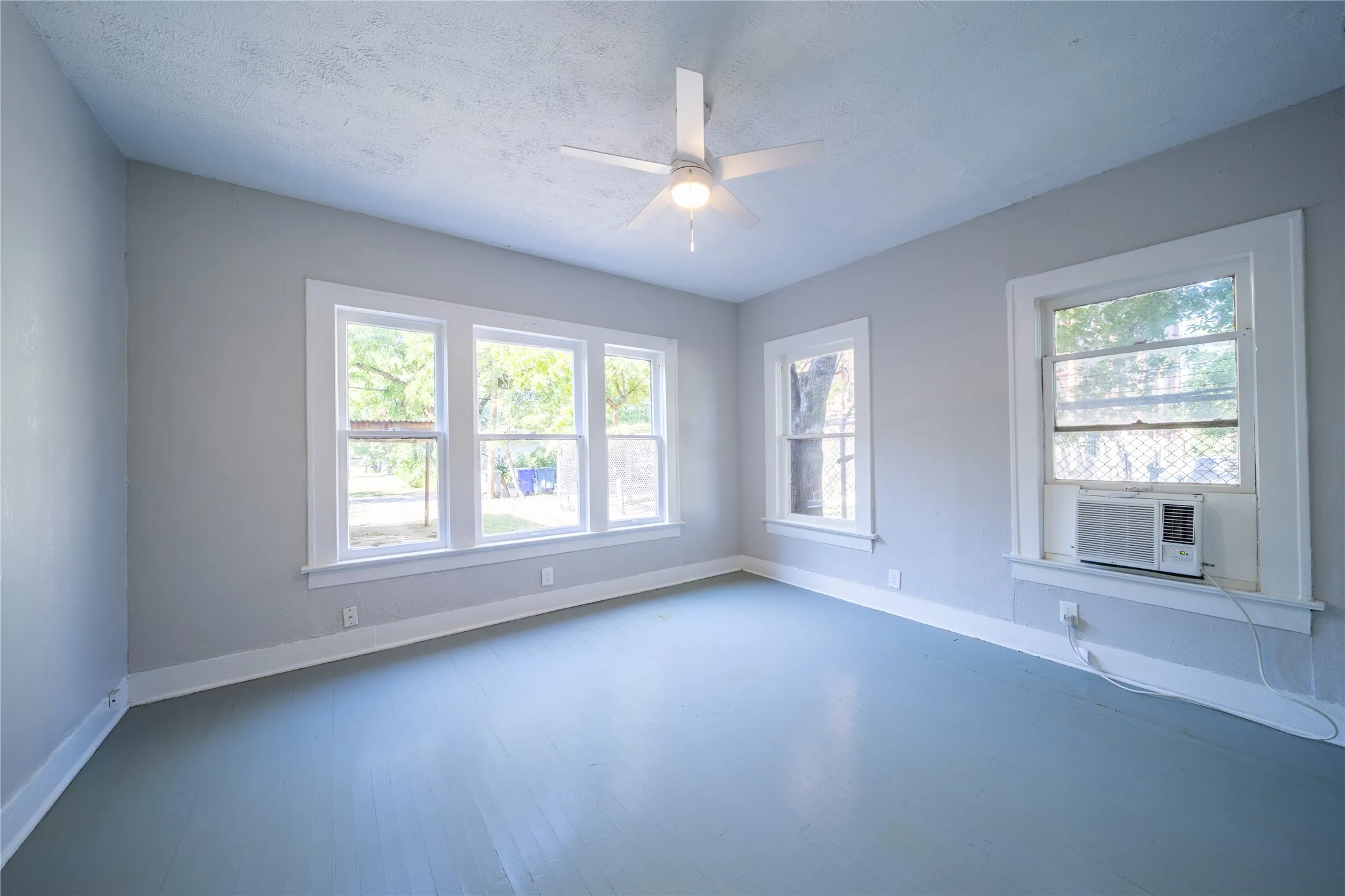 909 Sunset - The bedroom on the first level is located at the back of the home.
