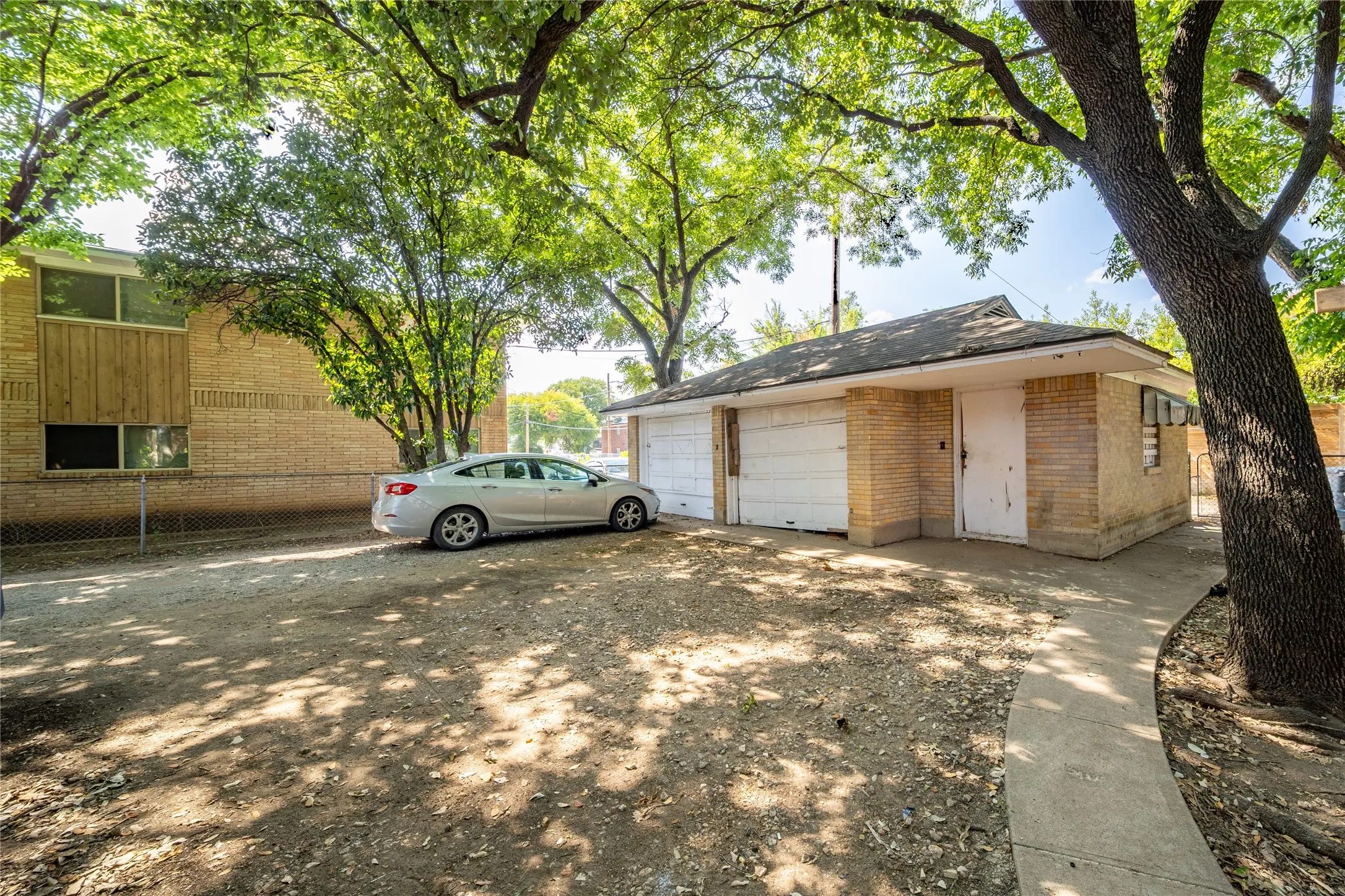 921 Sunset. Each unit has access to one garage parking spot.