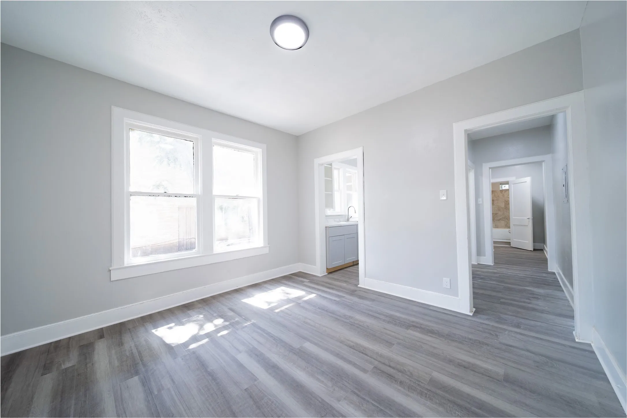 923 Sunset. The dining room is located between the living room and the kitchen. The door to the right leads to the hallway.
