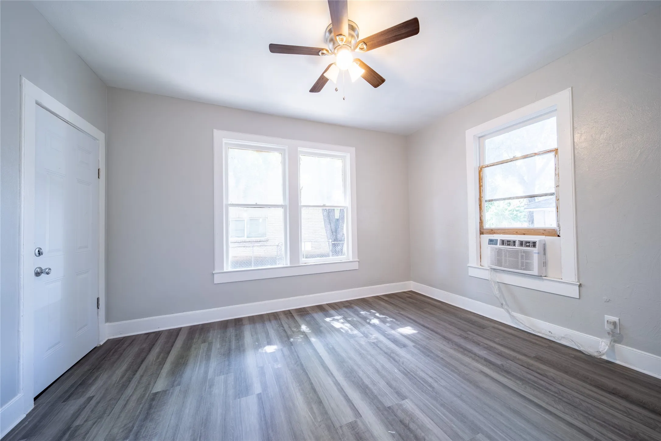 923 Sunset. The bedroom is located at the back of the home. The door in the photo connects to the side porch.