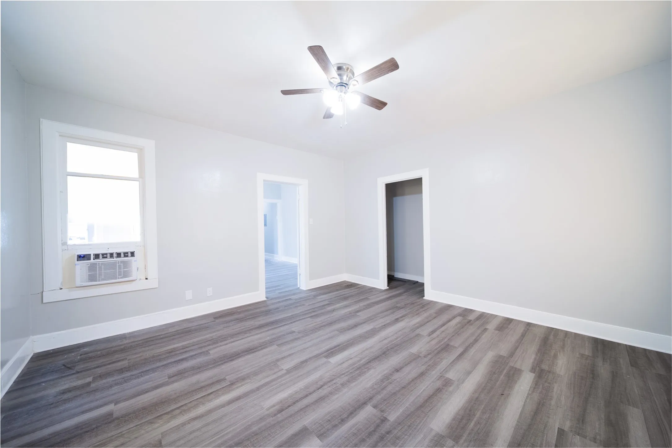 923 Sunset. The open doorway to the right in the photo is a storage closet in the living room. The other door leads to the dining room.