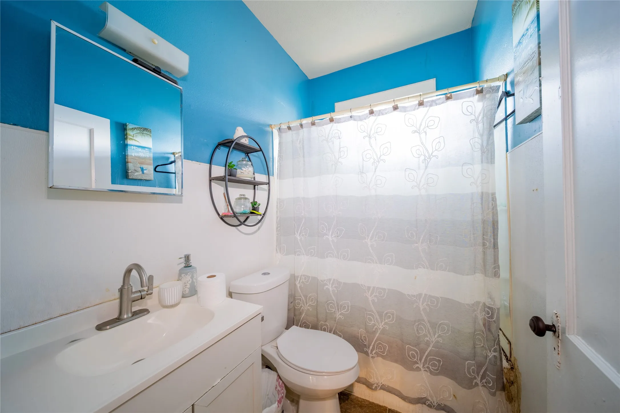 921 Sunset. The bathroom is located at the back of the home and is adjacent to the bedroom.