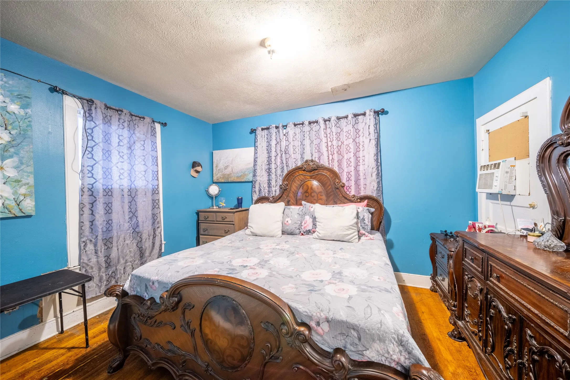 921 Sunset. The bedroom is located at the back of the home.  The door in the photo leads to a side porch.