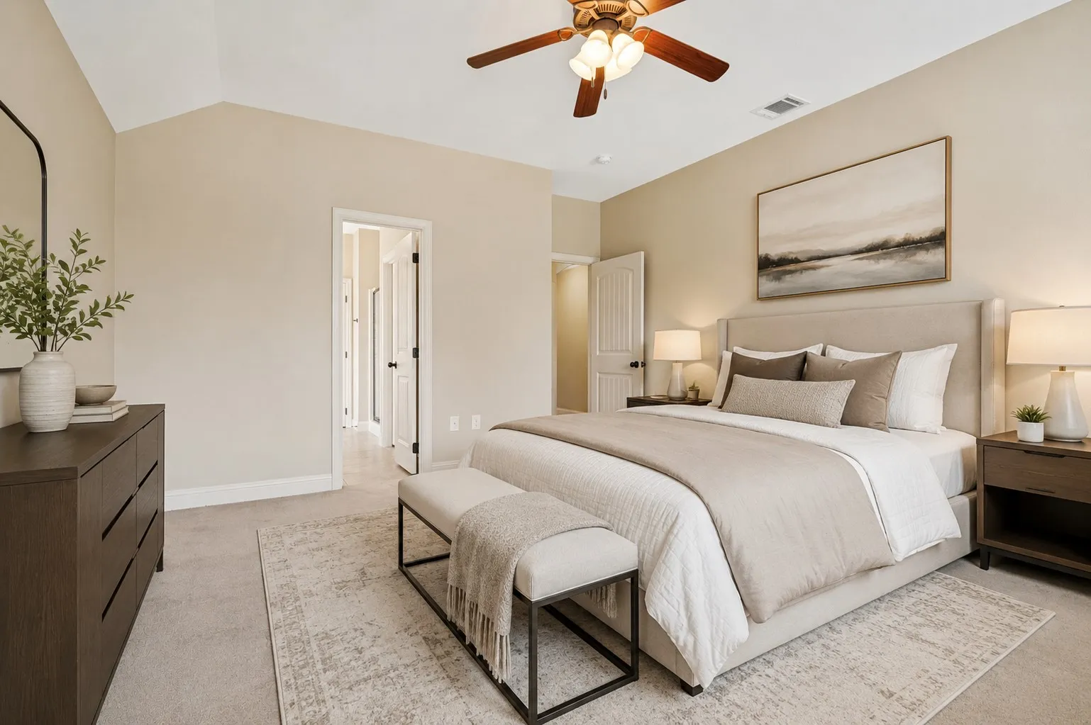 Bedroom featuring a vaulted ceiling and a wood-finish ceiling fan