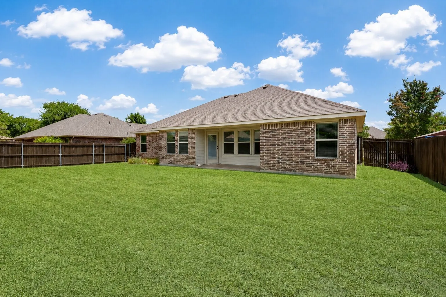 Expansive green lawn providing ample outdoor space