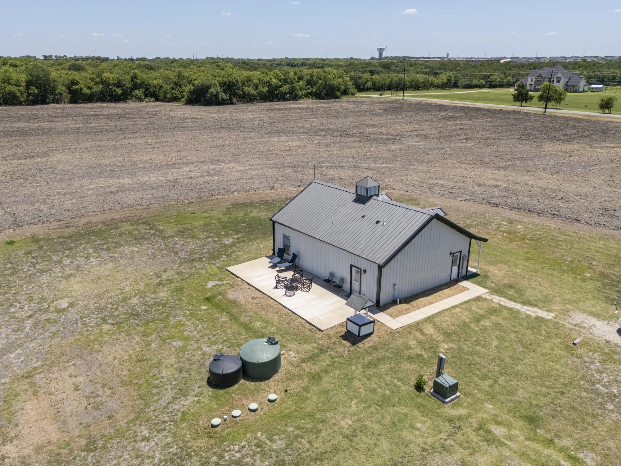 Septic system and water cistern at back of the home~