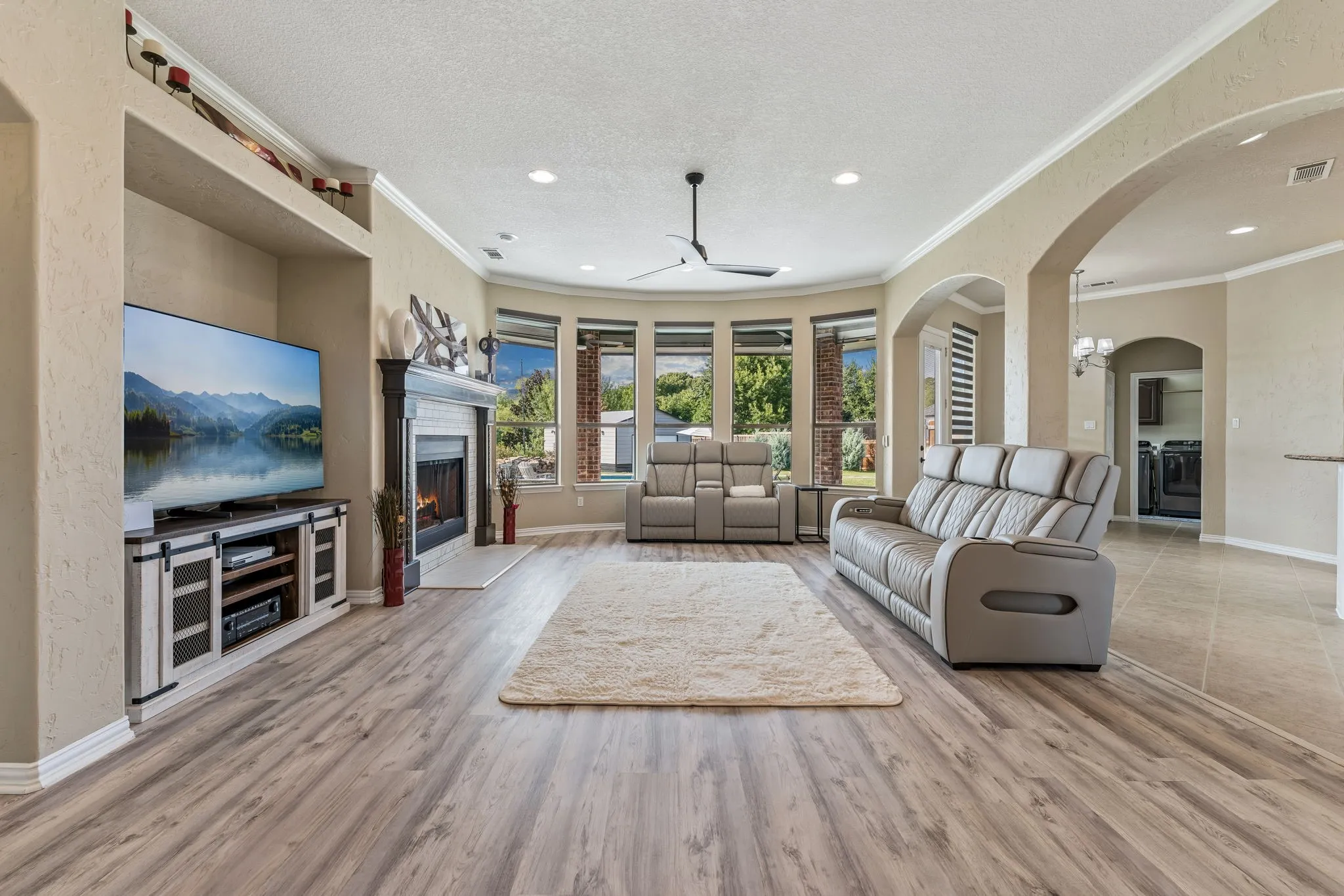 First floor living room with views of the back yard and open to the kitchen.