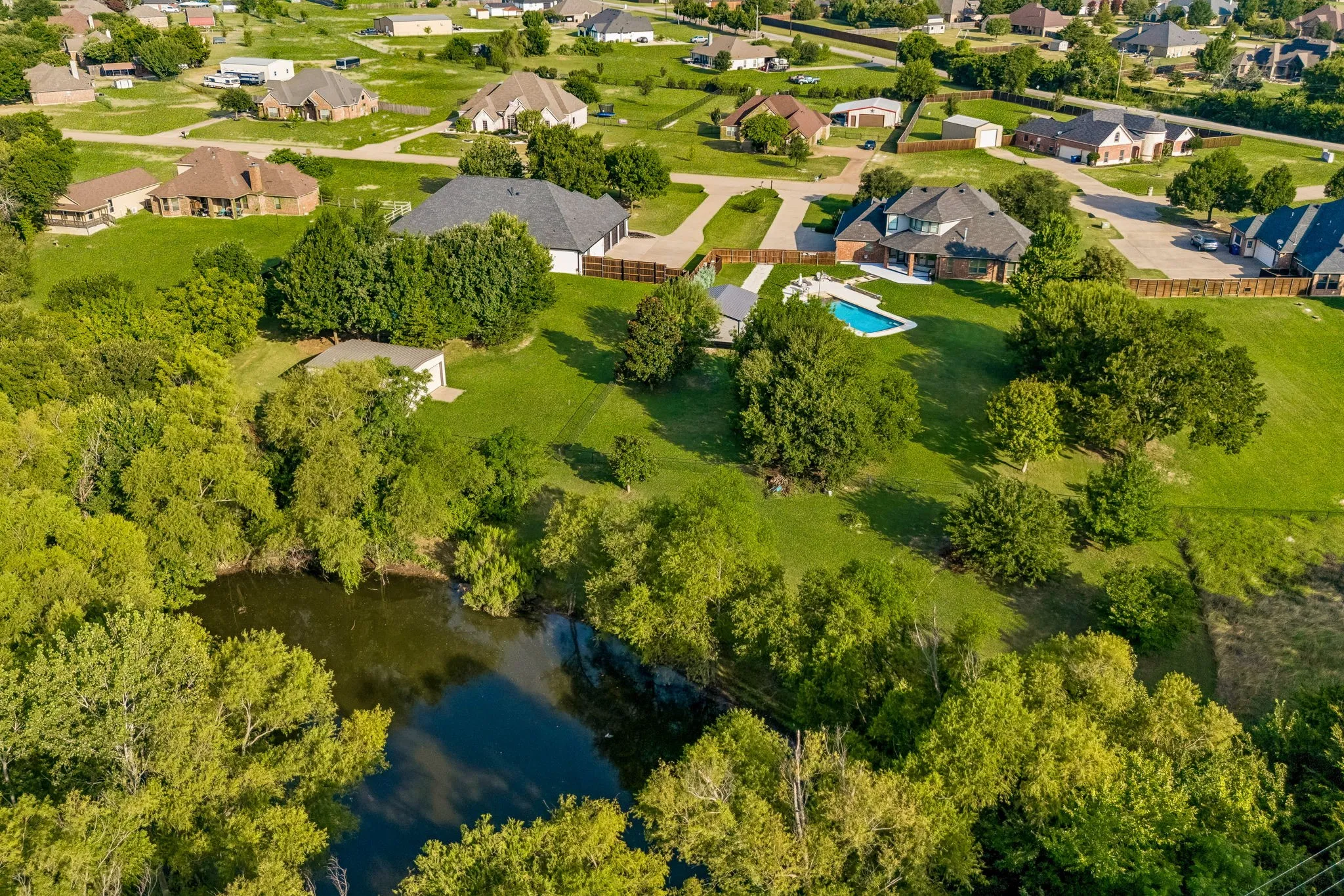 Back yard picture with access to the pond.