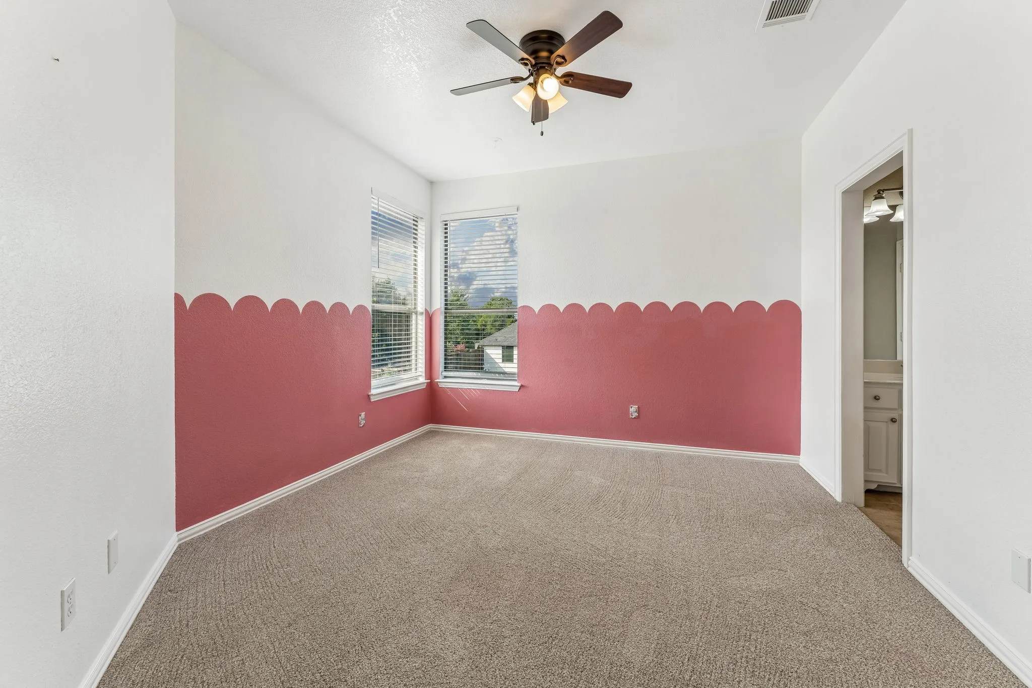 Guest bedroom with jack and jill bath and walk-in closet.