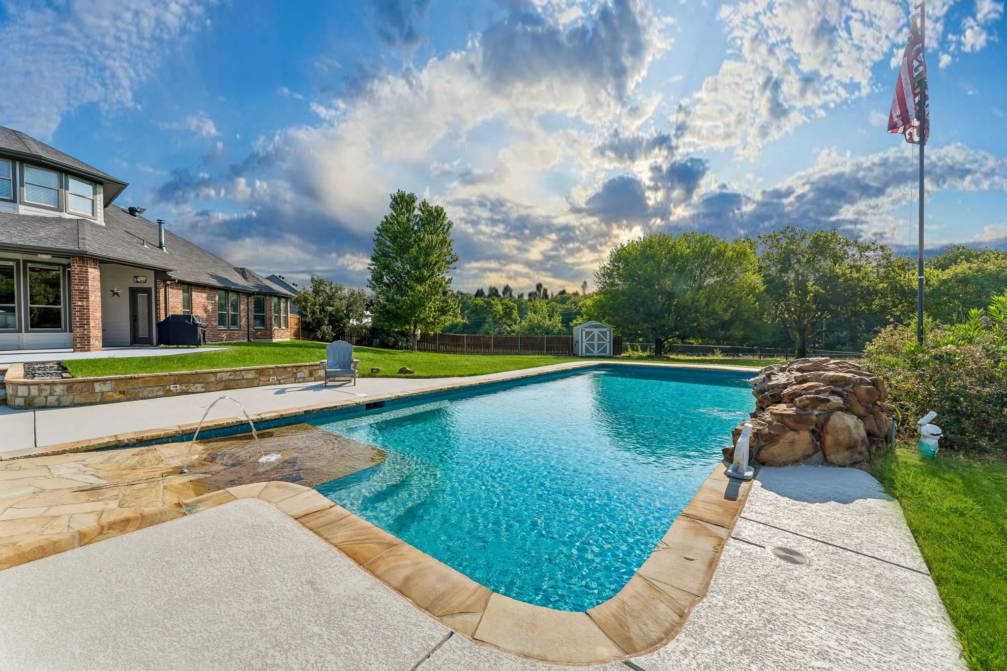 Pool with beach walk-in and fountain.