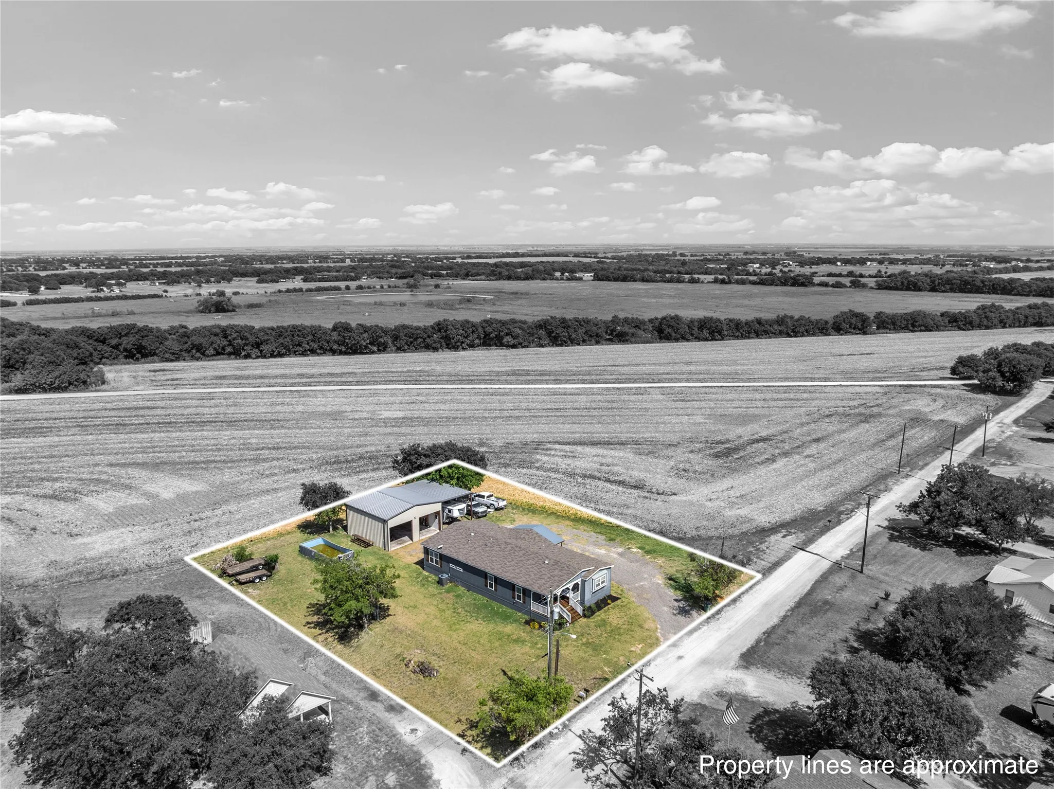 Single-story residence featuring a covered front porch and a dark-toned roof