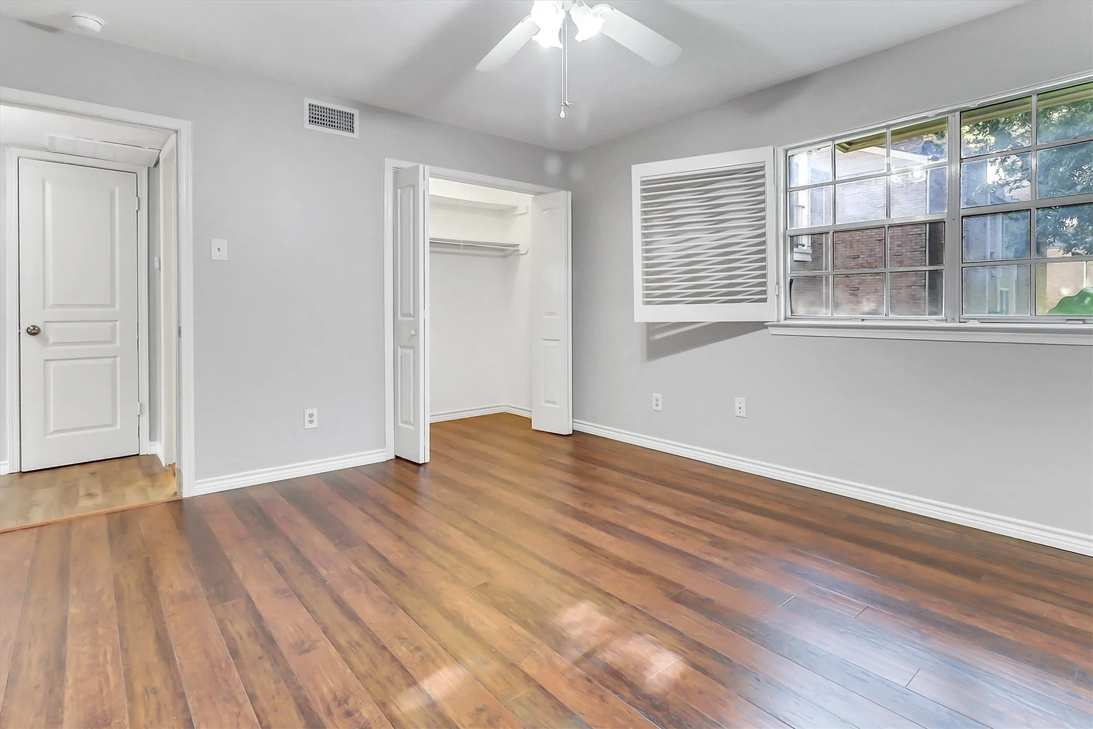 Large bedroom with ceiling fan