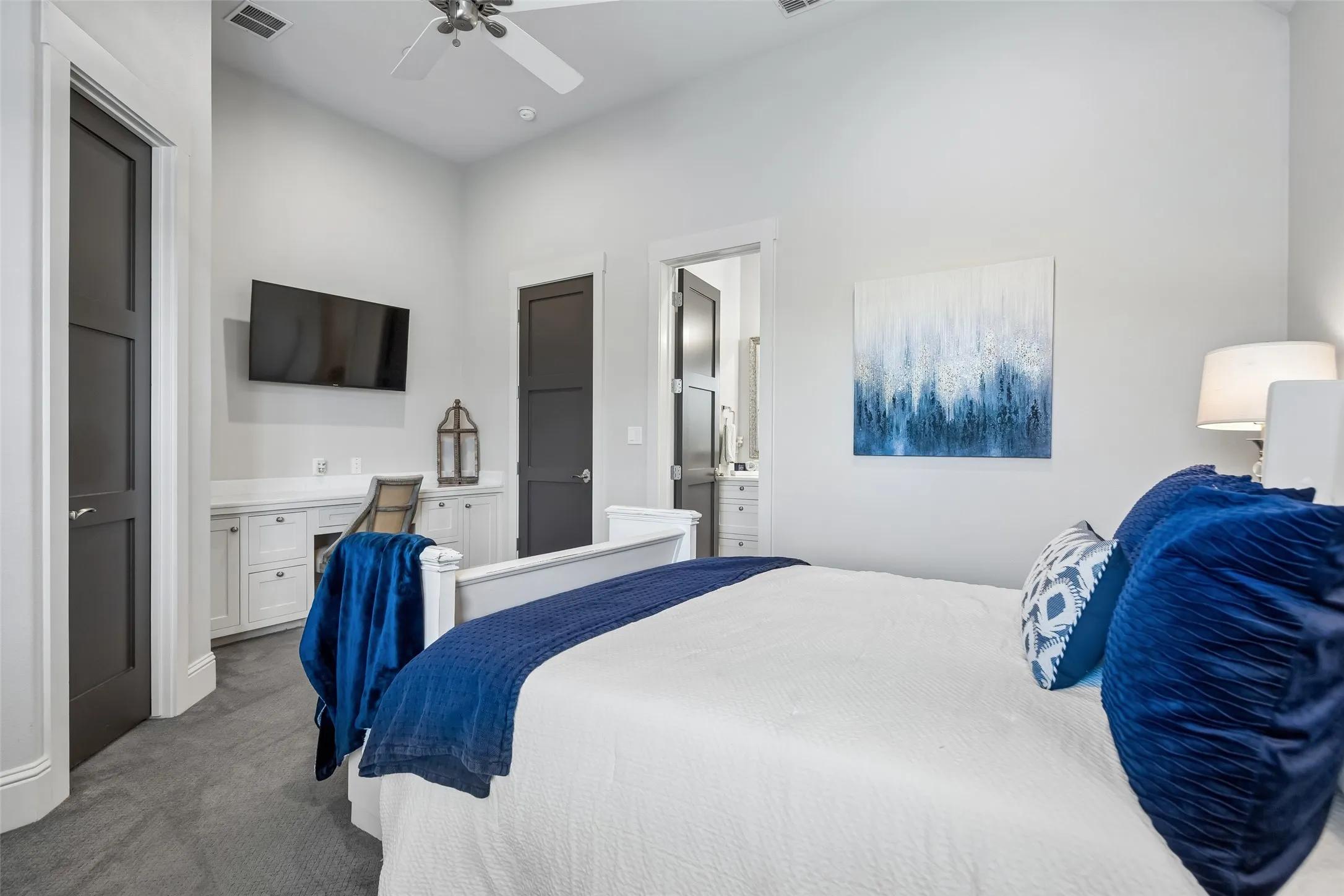 A Jr. Suite with Added Functionality – This secondary bedroom includes a built-in desk, private bath access, generous closet storage, and enough space to serve comfortably as both a sleeping area and personal retreat.