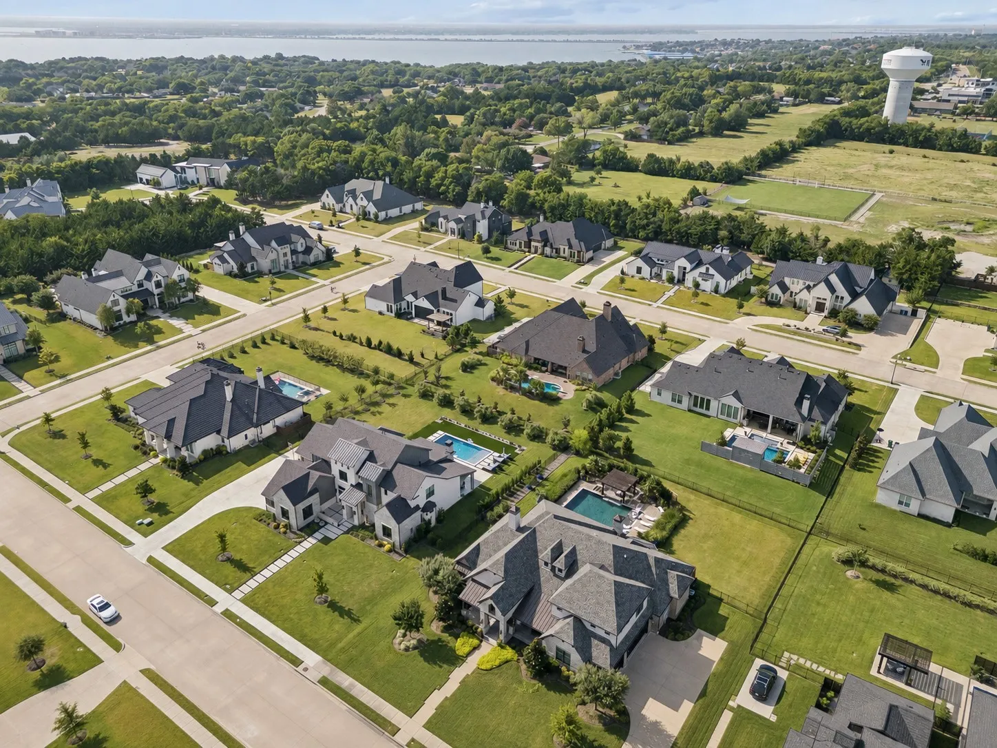 The Renaissance with Lake Ray Hubbard Beyond – The neighborhood’s spacious homesites, custom residences, and nearby lake setting create a distinctive Heath backdrop for this property.