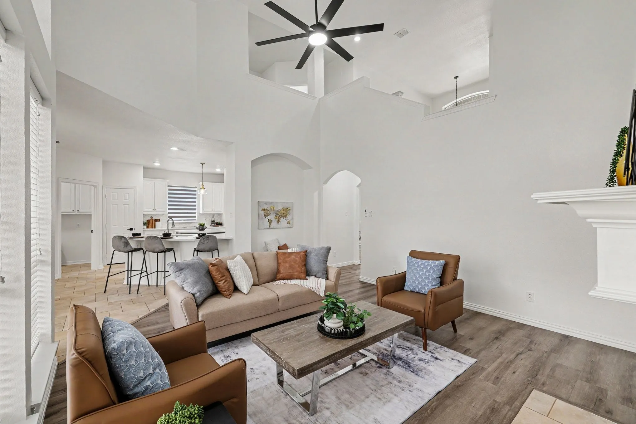 Vaulted ceilings featuring a ceiling fan and upper architectural details