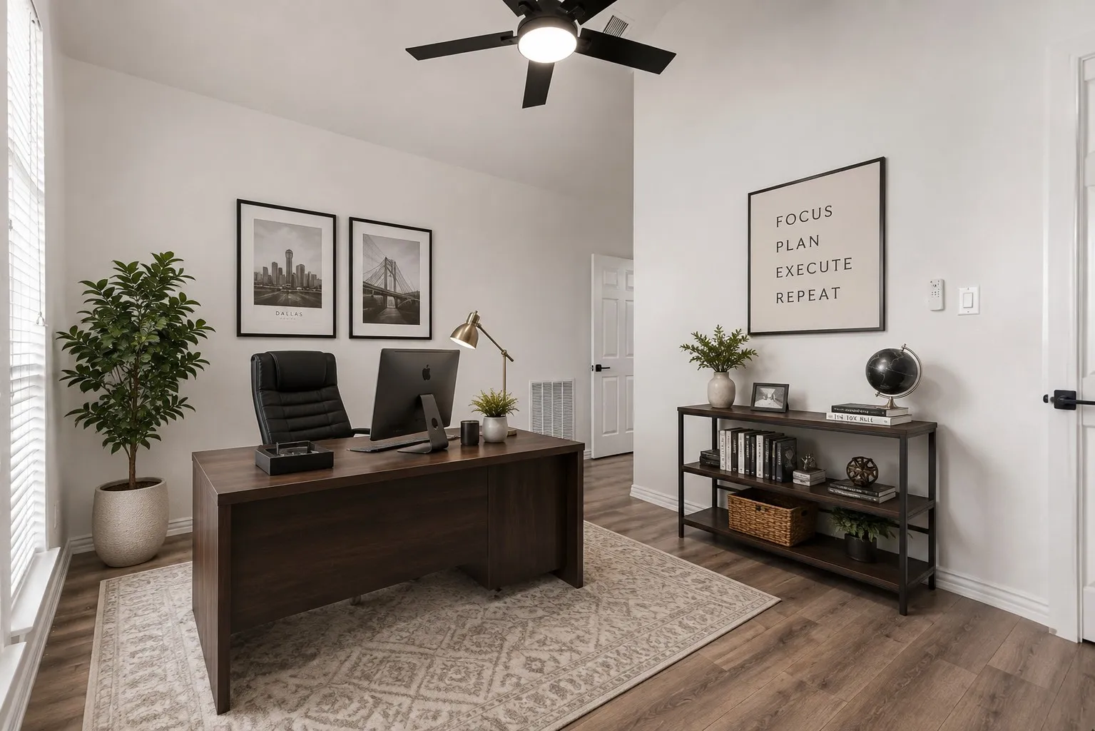 Wood-finish flooring, white walls, and a ceiling fan with light fixture