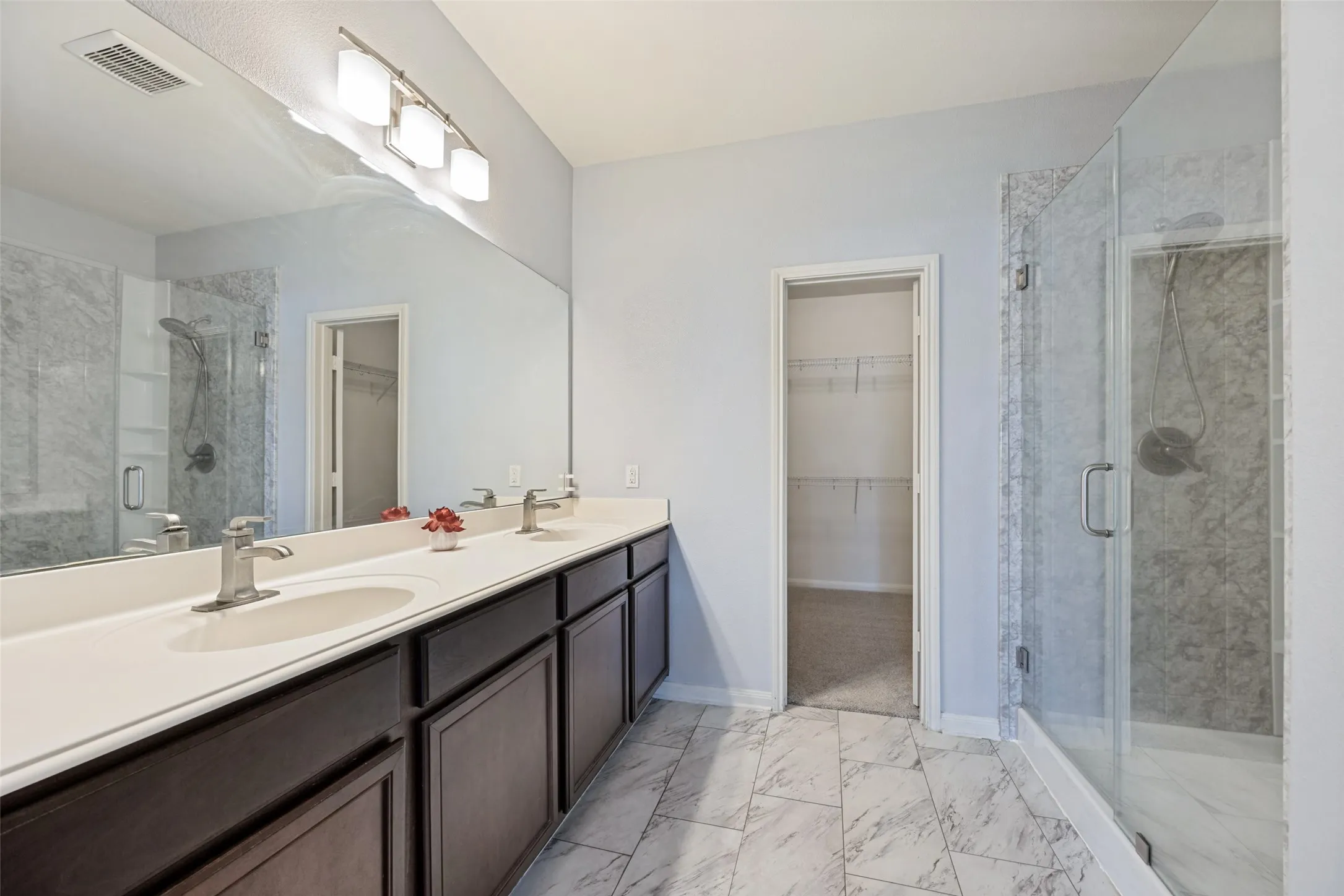 Updated primary bathroom with planty of storage space
