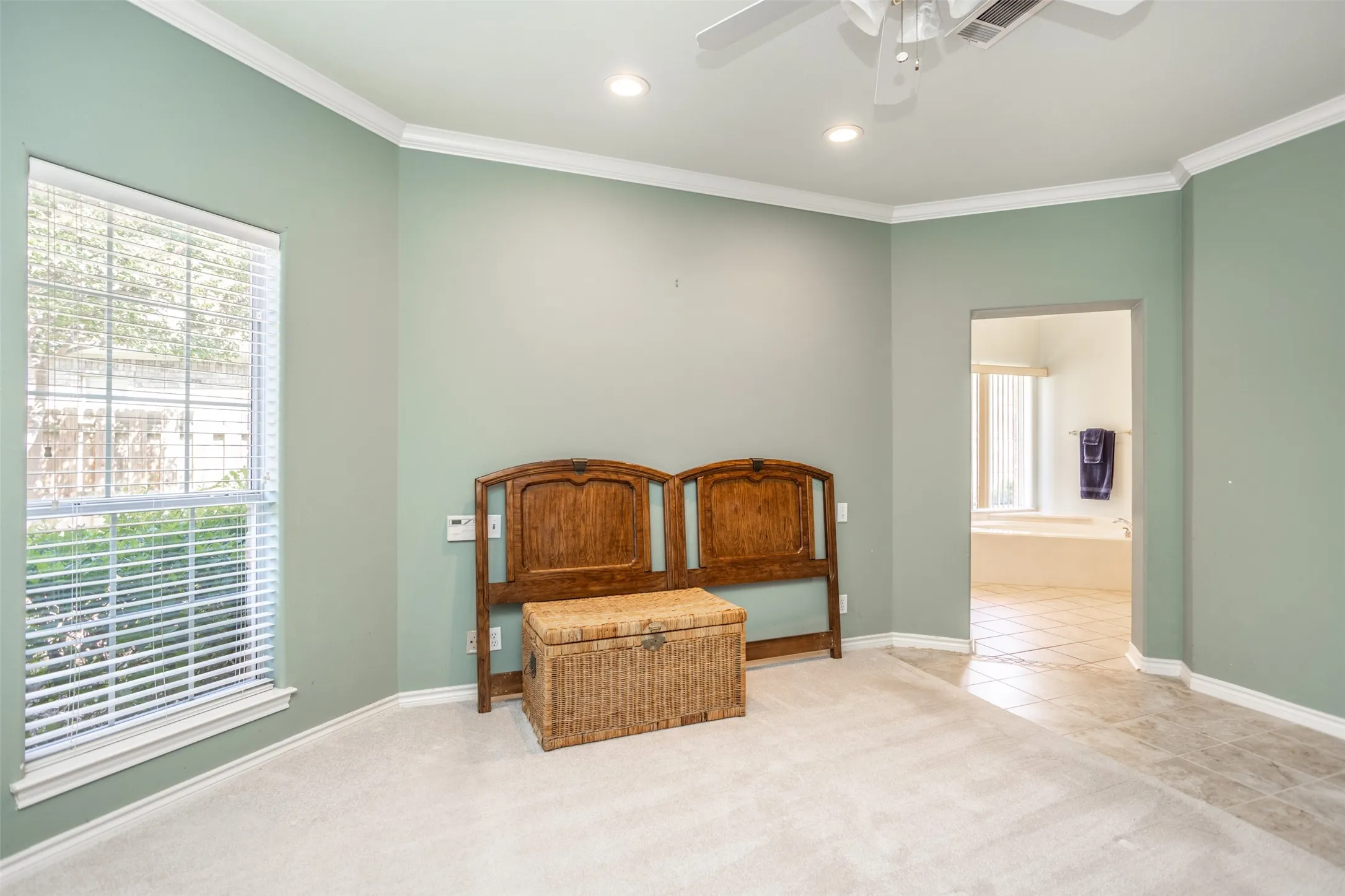 Primary bedroom with walk out patio
