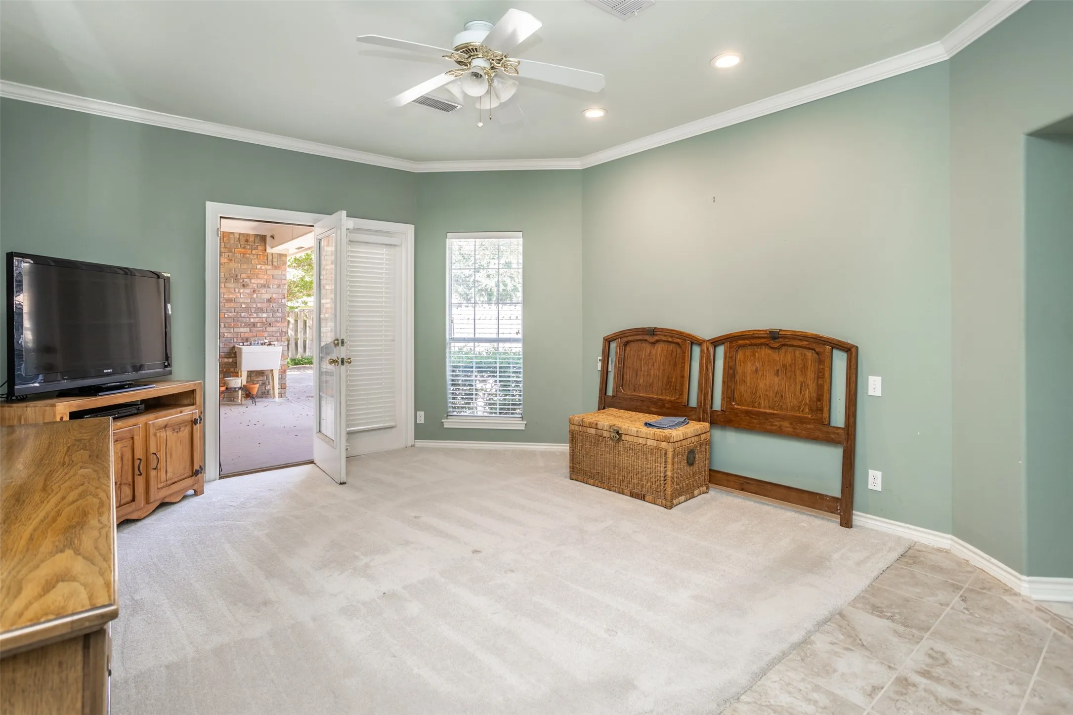 Primary bedroom with walk out patio