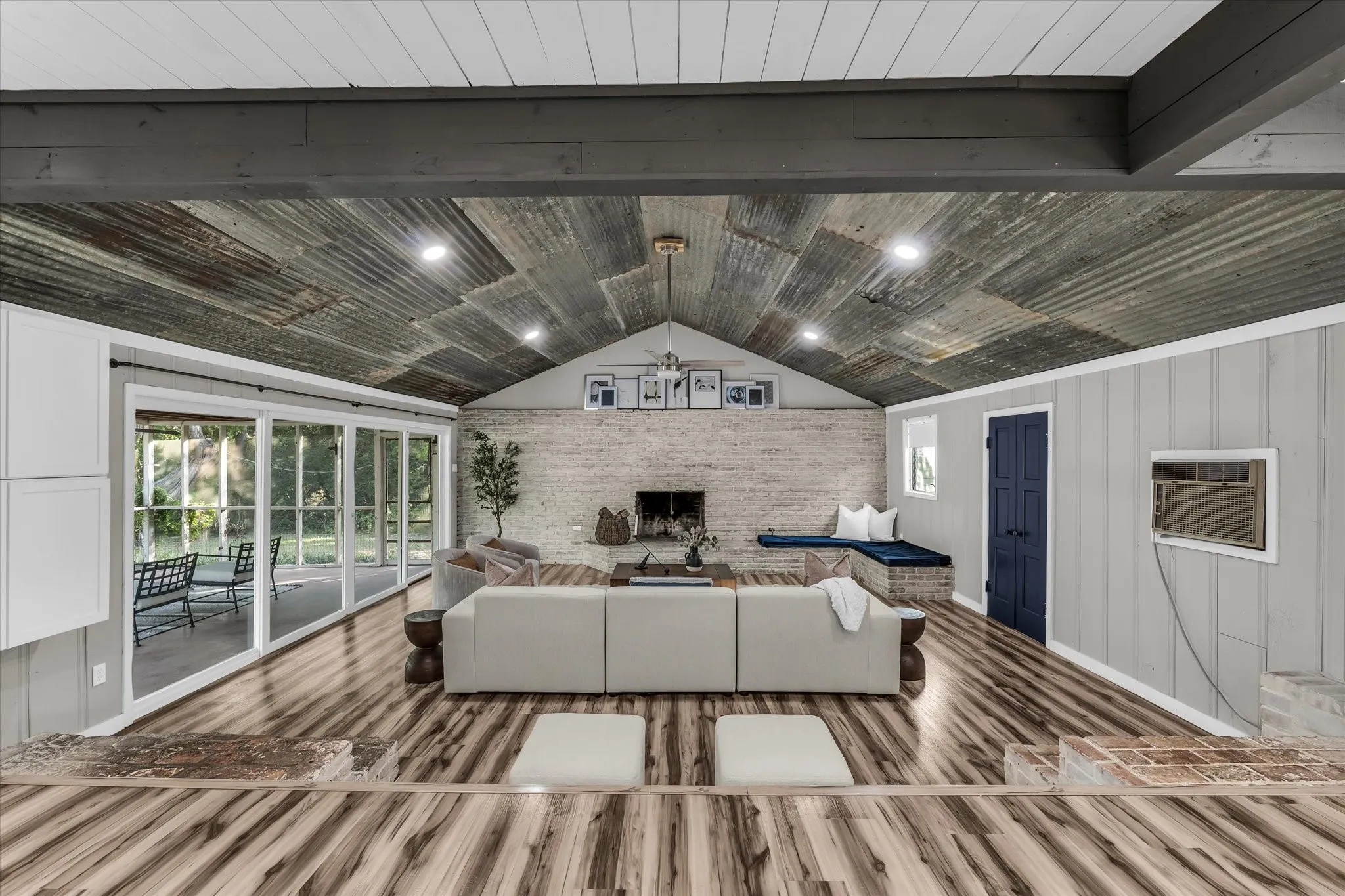 Vaulted ceiling with corrugated metal and recessed lighting
