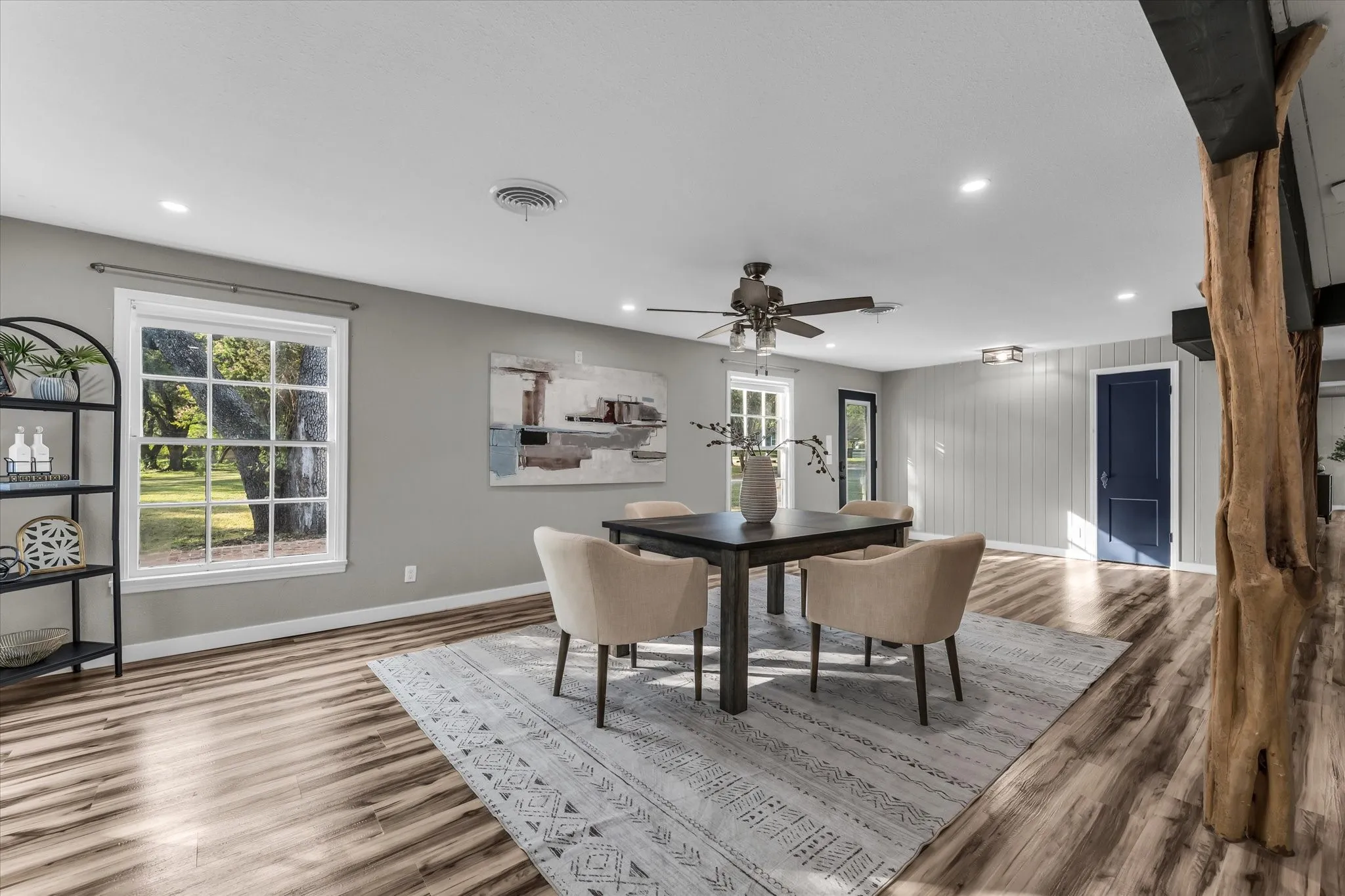 Spacious room featuring wood-finish flooring, recessed lighting, and a neutral wall color