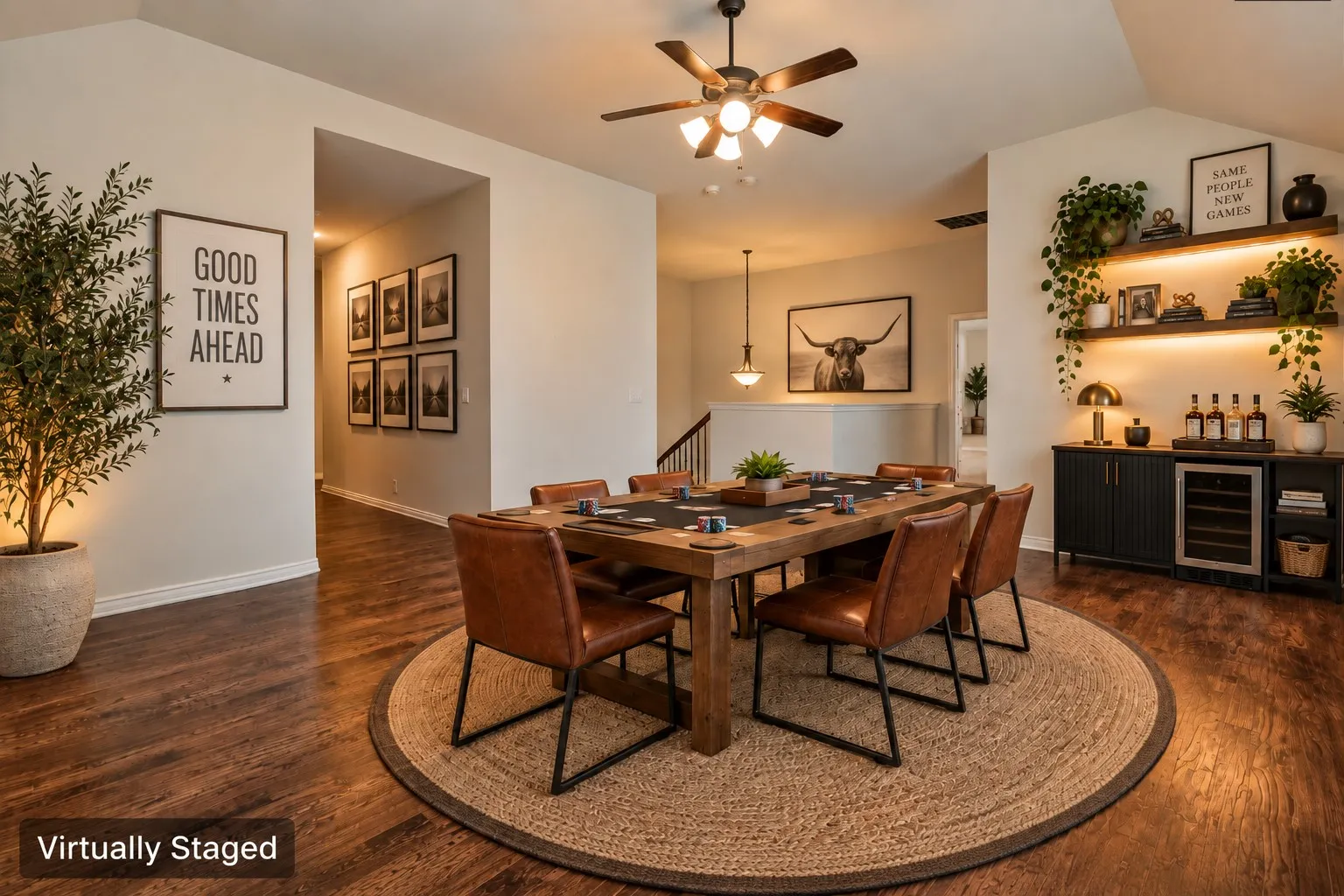 Wood-finish flooring throughout, featuring a vaulted ceiling with a ceiling fan