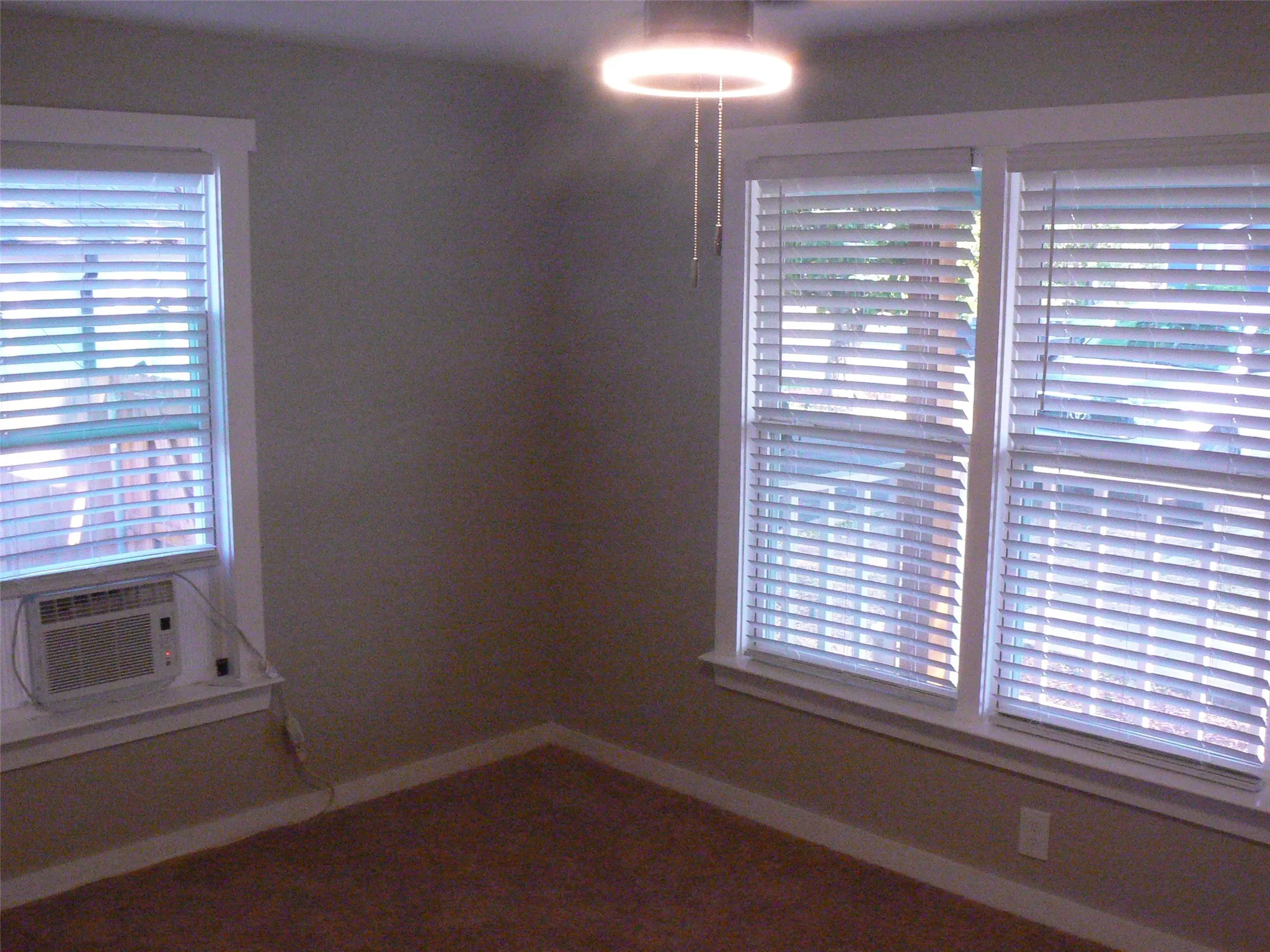 Second bedroom with lots of natural light, also carpeted, and ceiling fan.