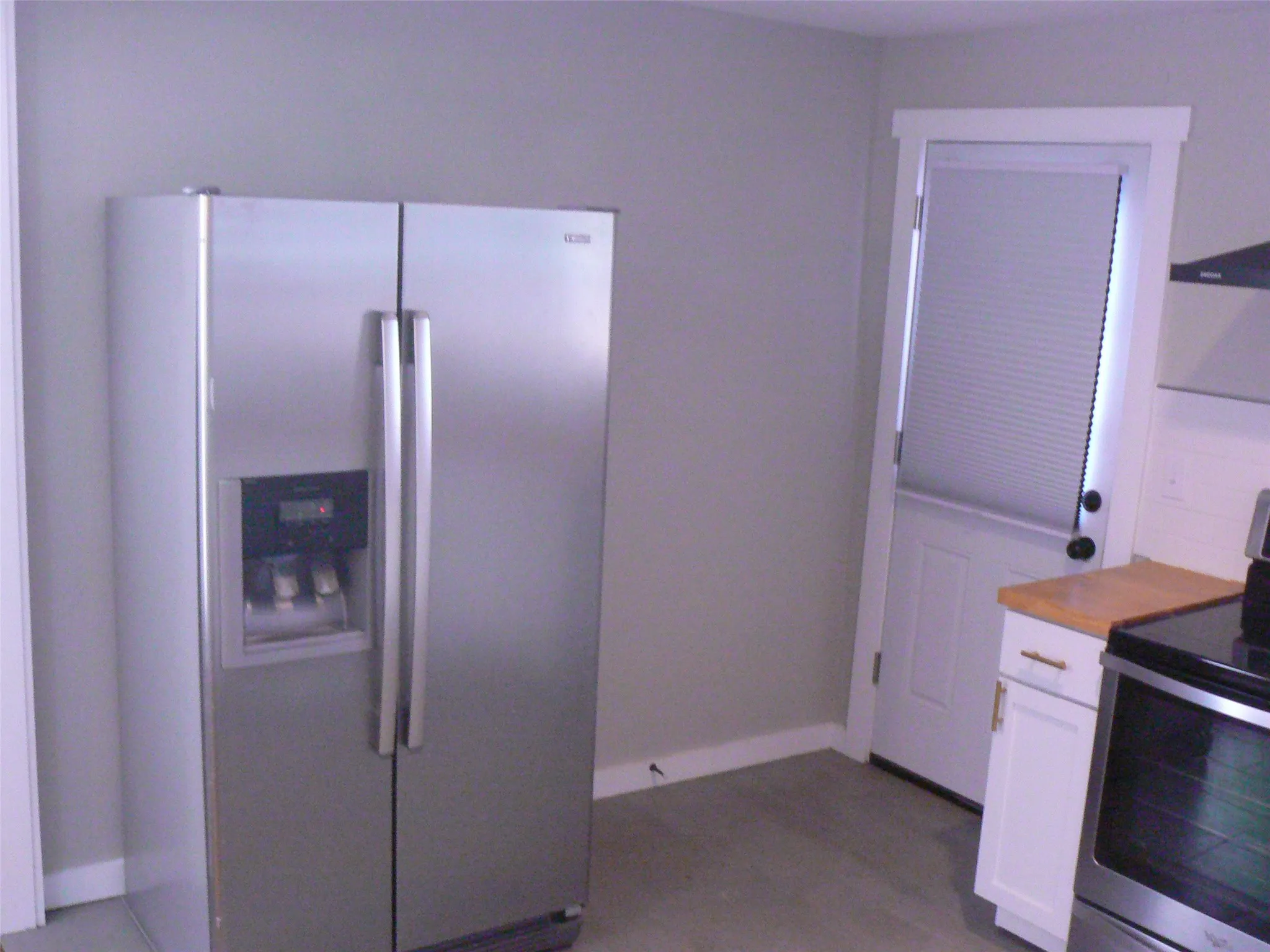 Side-by-side refrigerator with ice maker and plenty of storage.