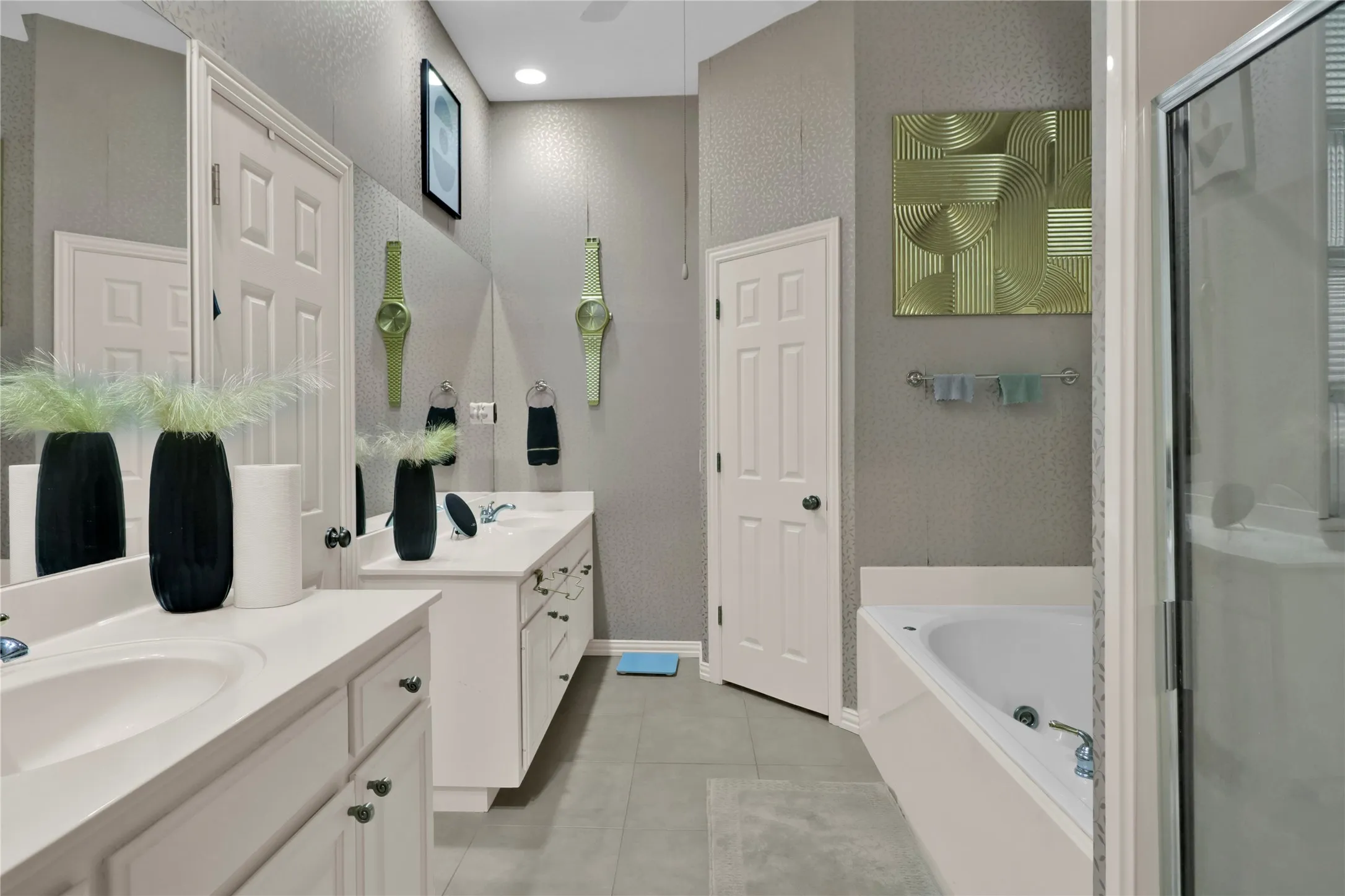 Master bath with dual vanities, separate shower and large walk in shower.