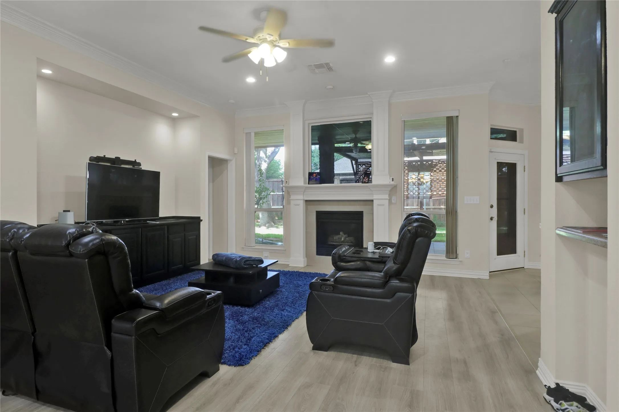 The family room opens to kitchen, dining and breakfast area and leads to master suite and formal living room.
