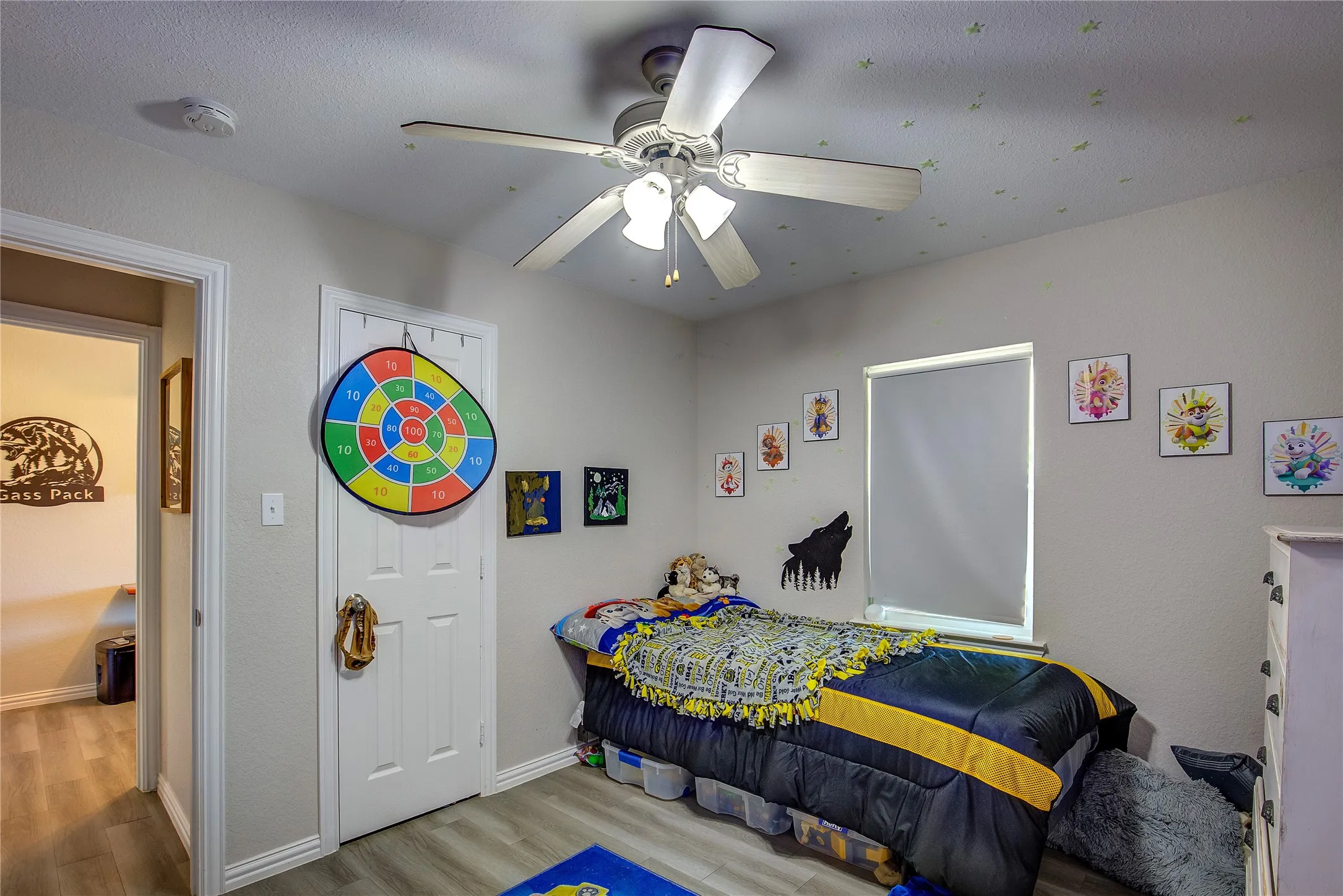 Bedroom with wood finished floors and a ceiling fan