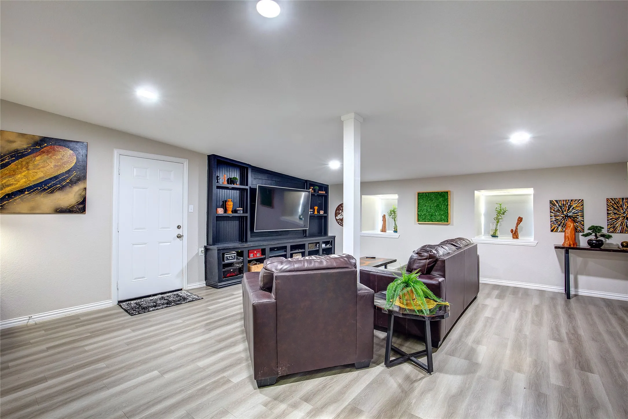 Living room featuring light wood-style floors and recessed lighting