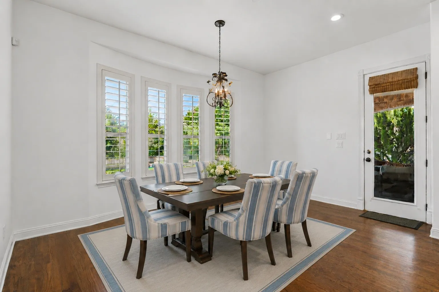Eat-in breakfast nook is large! Surrounded by gorgeous nature views of the backyard. Virtual Staged.
